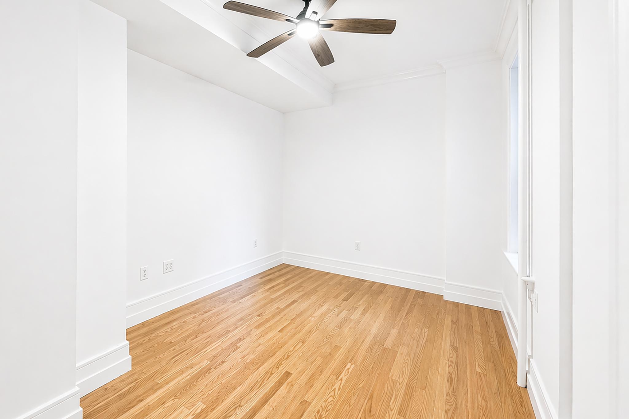 24-39 38th Street, Unit B10B9 Queens, NY 11103 - Photo 12 of 20 a view of an empty room with wooden floor