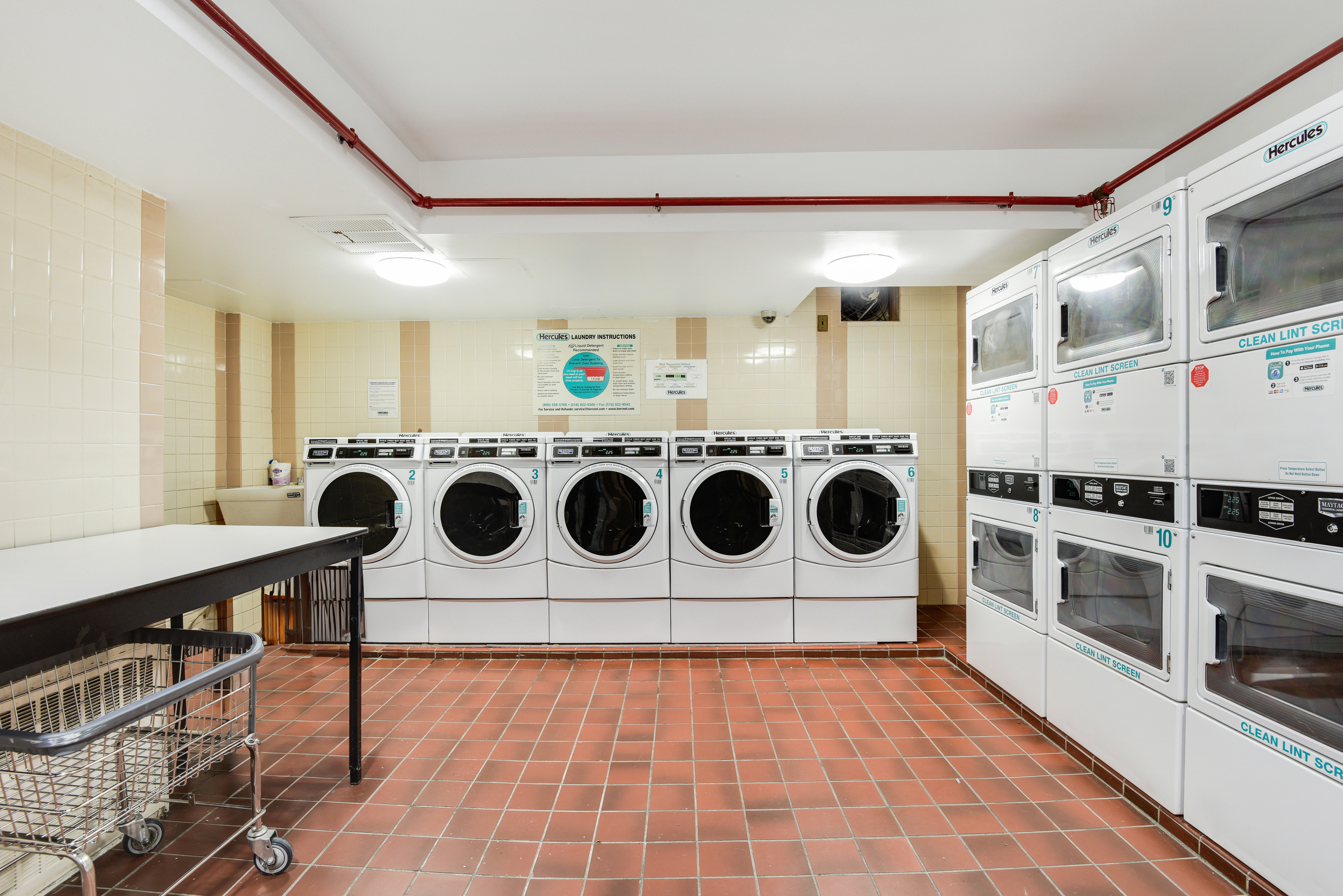 417 East 90th Street, Unit 1G Manhattan, NY 10128 - Photo 9 of 10 a kitchen with a stove a microwave and a refrigerator