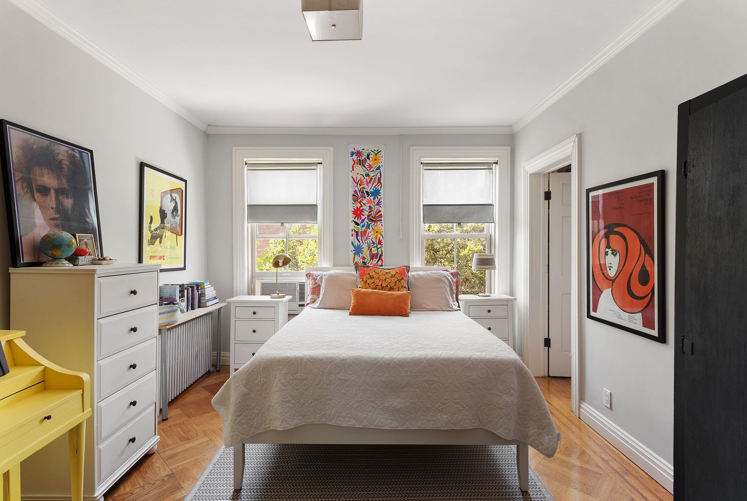 a bed room with a bed and a dresser