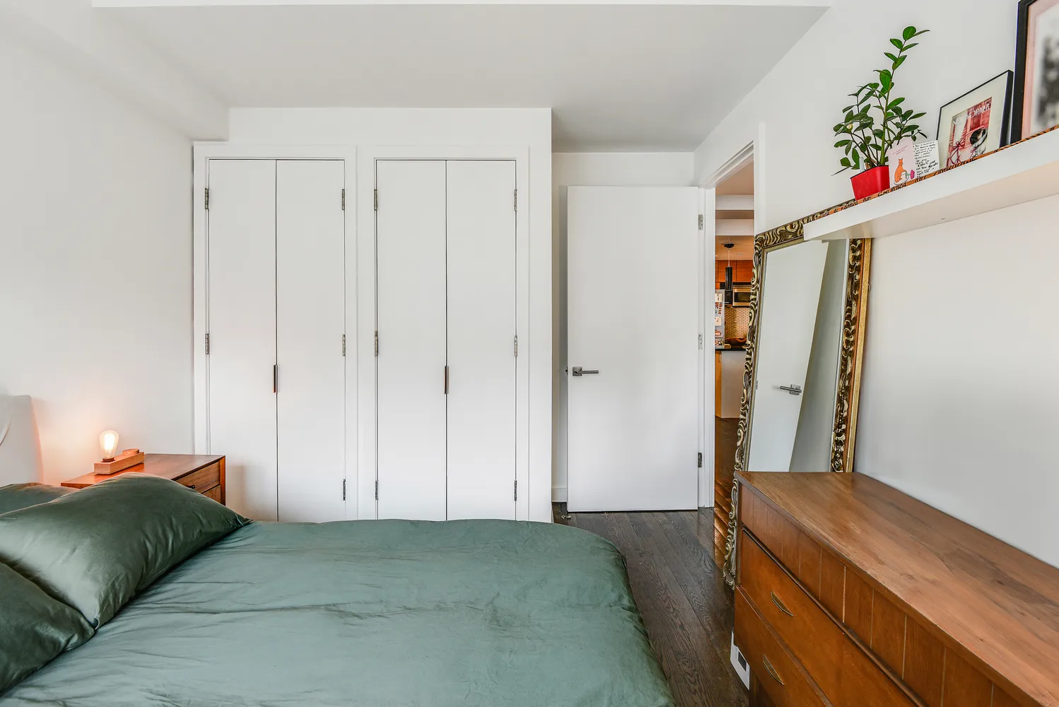 a bedroom with a bed and a couch