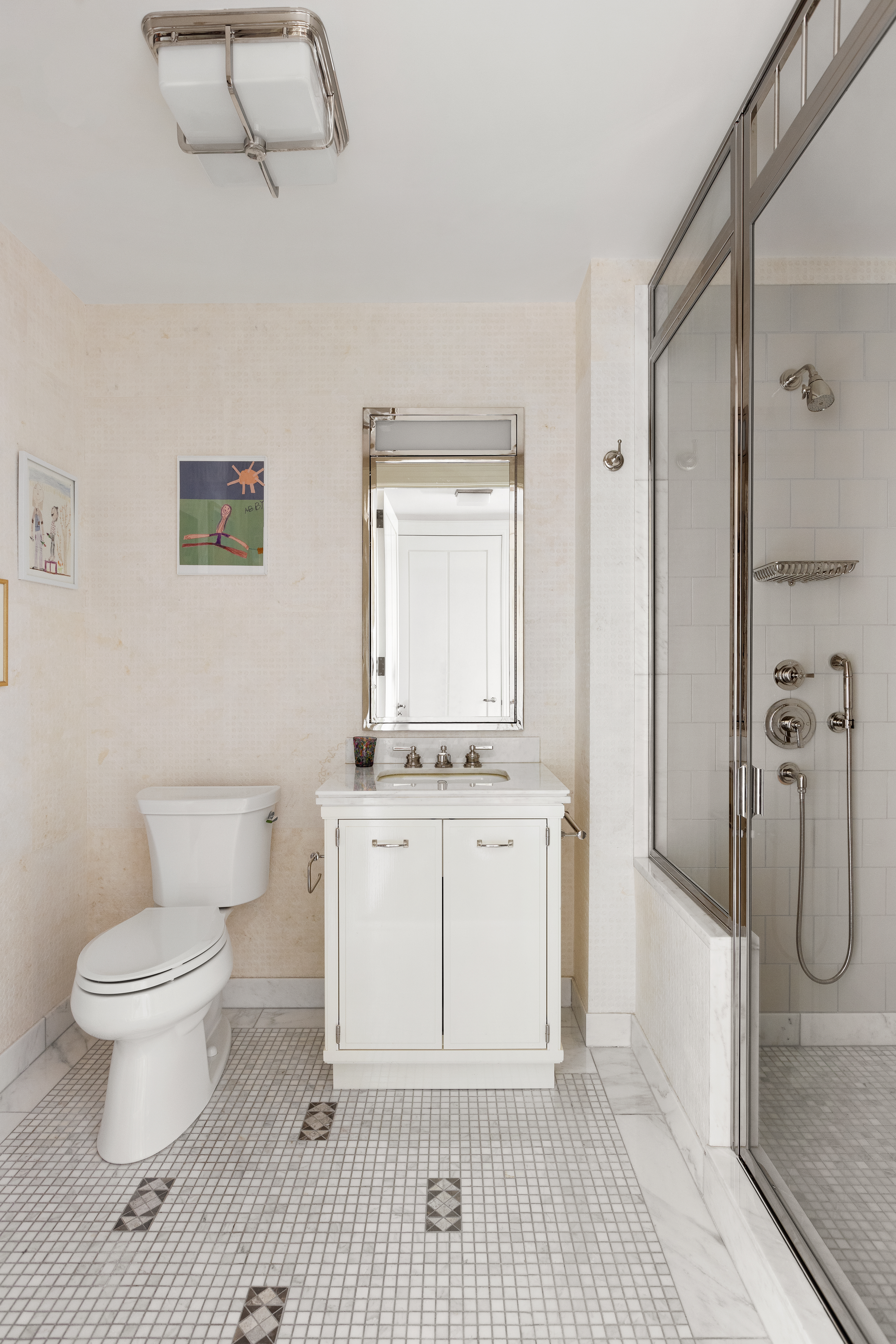 160 West 12th Street, Unit 104 Manhattan, NY 10011 - Photo 15 of 28 a bathroom with a sink a toilet and shower