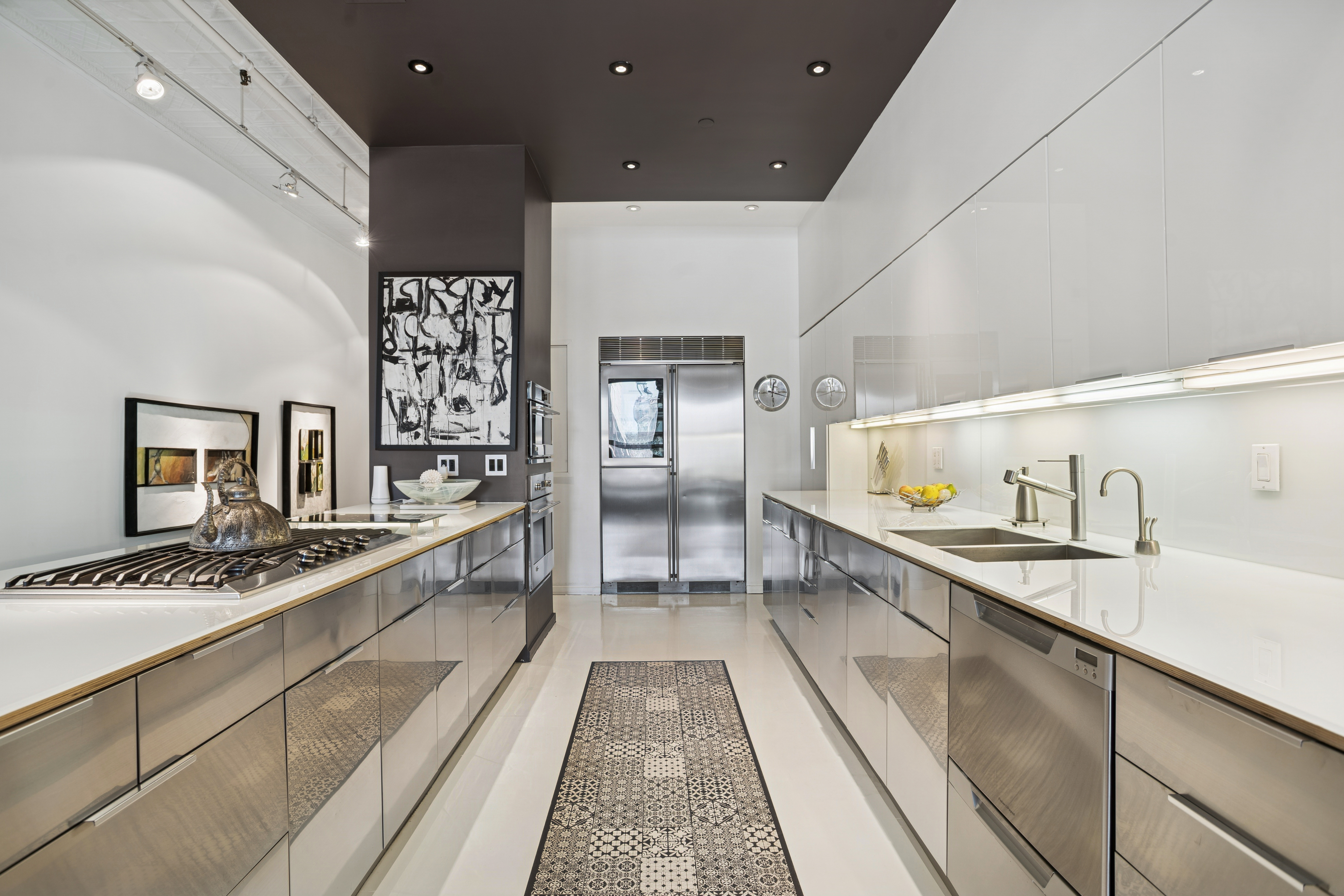 716 Broadway Manhattan, NY 10003 - Photo 3 of 15 a large white kitchen with a large window