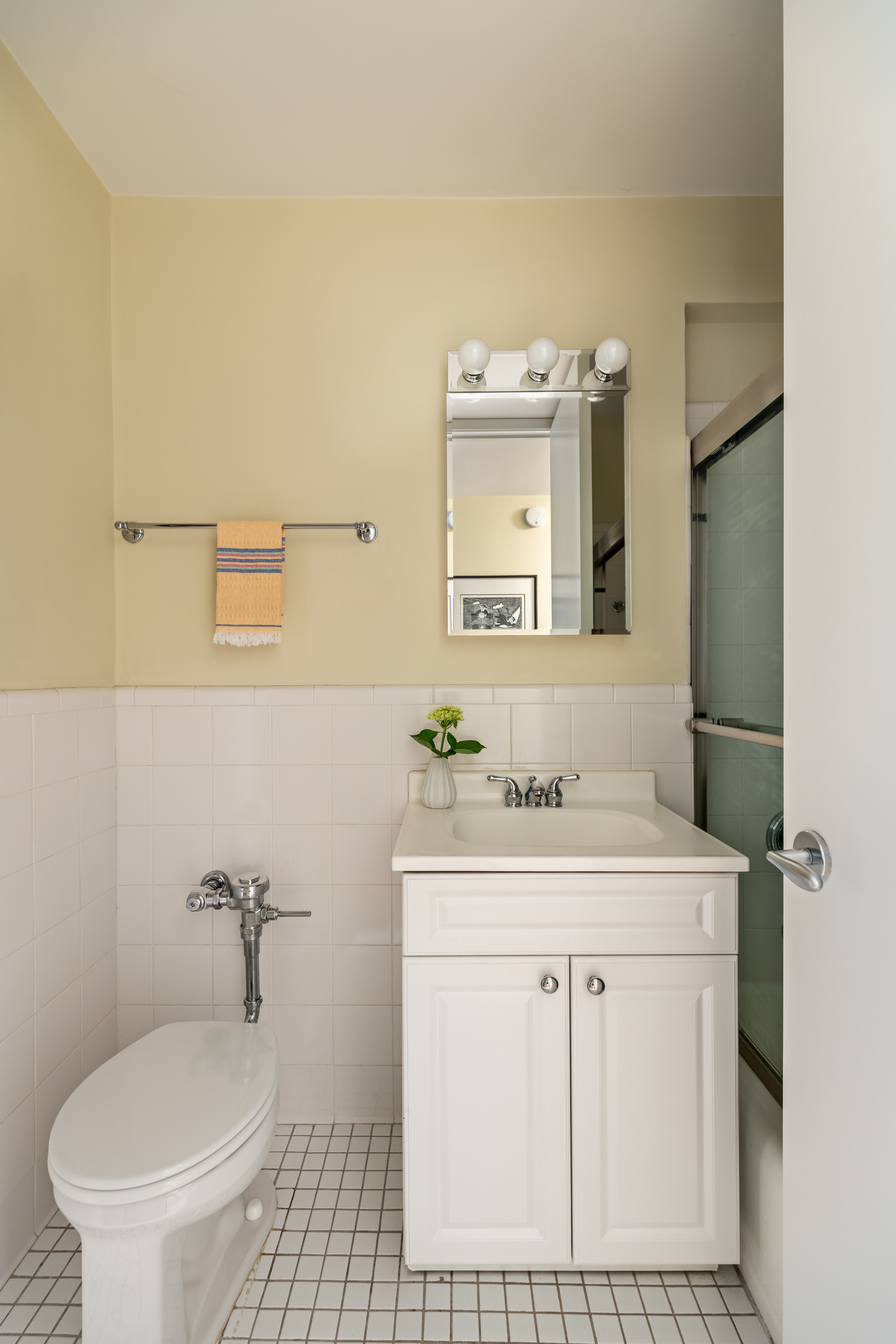 31 Jane Street, Unit 3H Manhattan, NY 10014 - Photo 11 of 14 a bathroom with a sink toilet and mirror