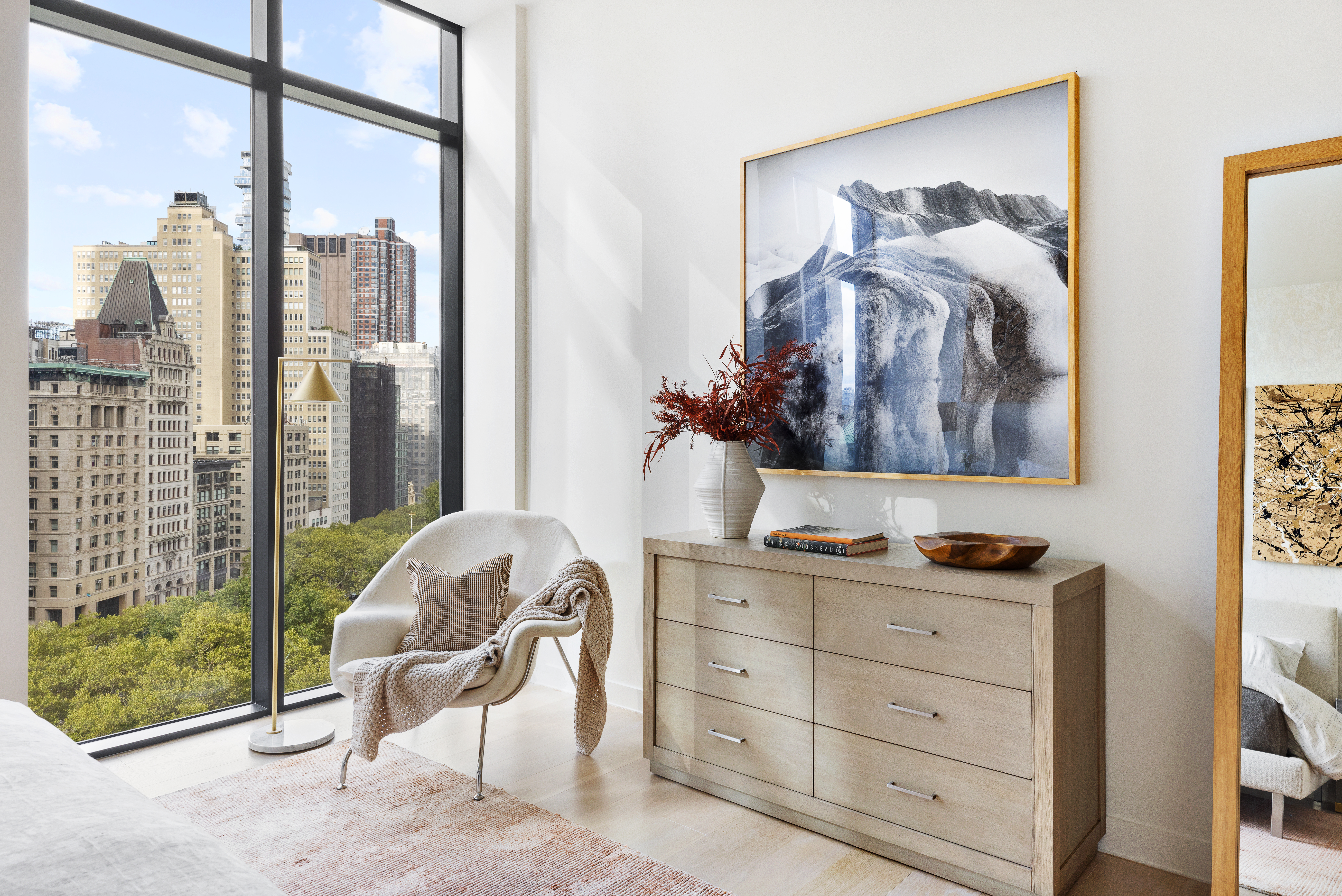 33 Park Row, Unit 11A Manhattan, NY 10038 - Photo 15 of 26 a living room with furniture and a painting on the wall