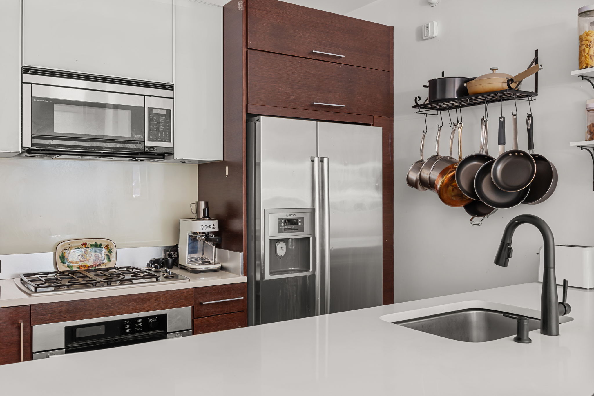 161 North 4th Street, Unit 1C Brooklyn, NY 11211 - Photo 4 of 10 a kitchen with stainless steel appliances granite countertop a sink stove and refrigerator