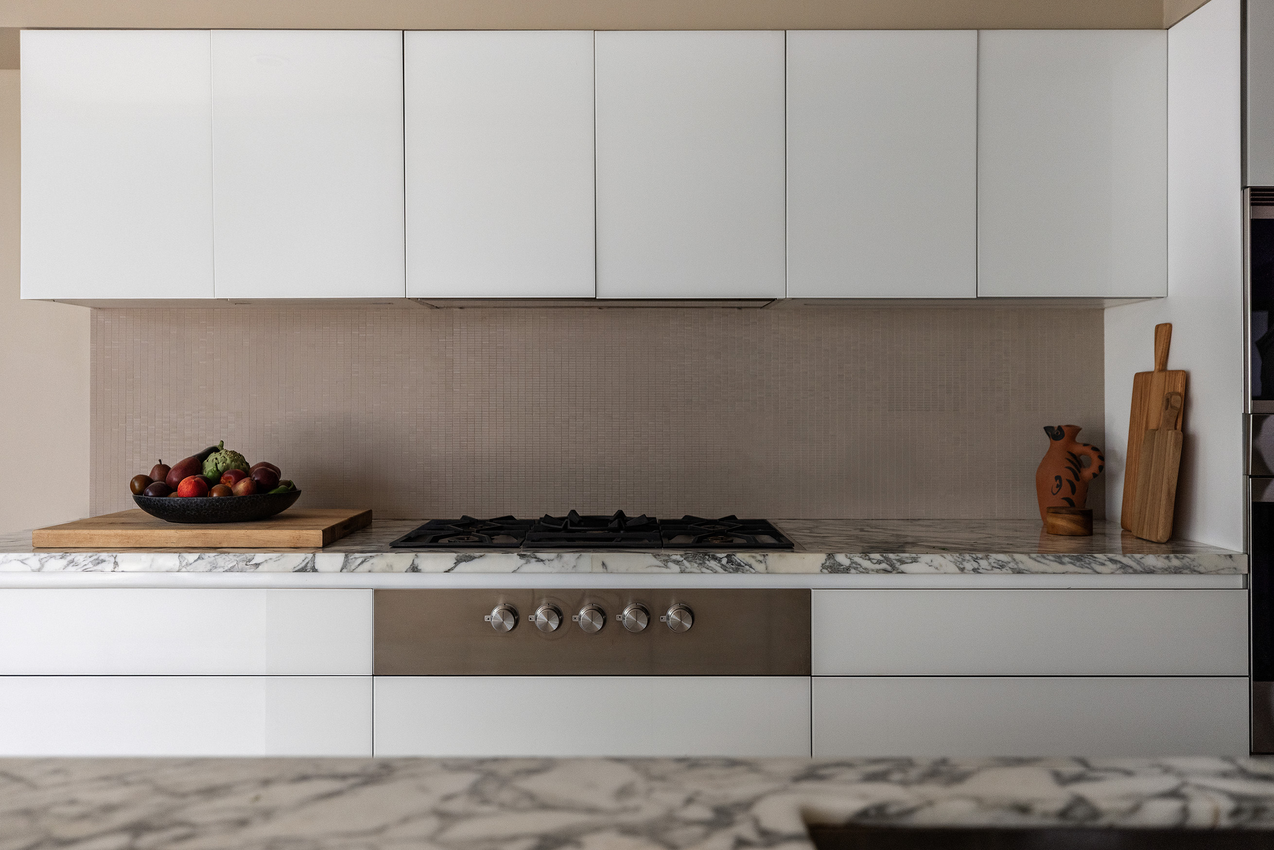 54 MacDougal Street, Unit 1 Manhattan, NY 10012 - Photo 5 of 23 a kitchen with white cabinets and sink