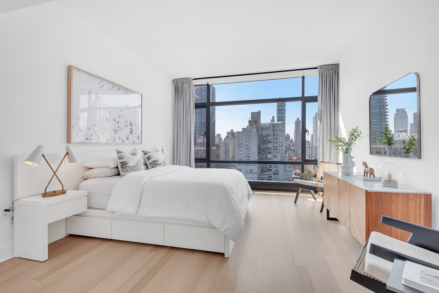 170 East End Avenue, Unit 16B Manhattan, NY 10128 - Photo 10 of 21 a bedroom with a large bed and a large window