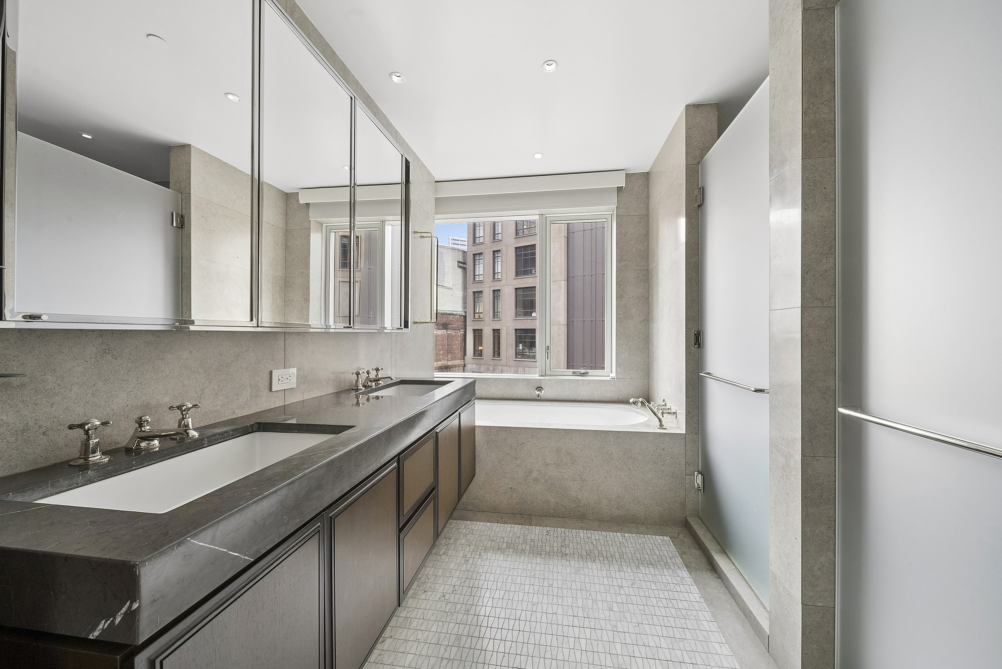 5 Beekman Street, Unit 30A Manhattan, NY 10038 - Photo 10 of 15 a kitchen with a sink and a refrigerator