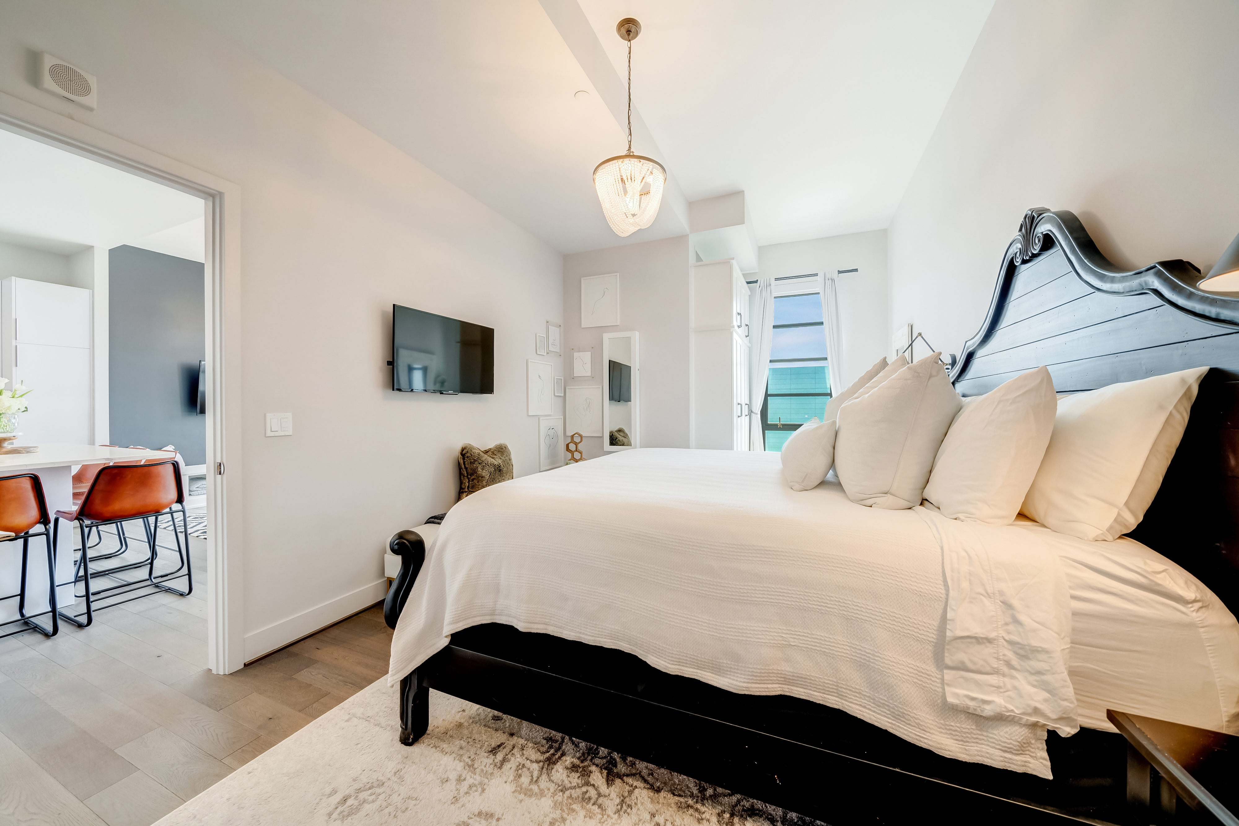 45 Sutton Square Southwest, Unit PH10 Washington, DC 20024 - Photo 23 of 44 a bedroom with a bed a dresser and chair