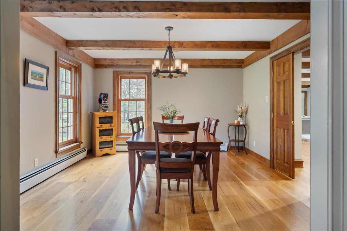 a spacious bedroom with a bed and a large window