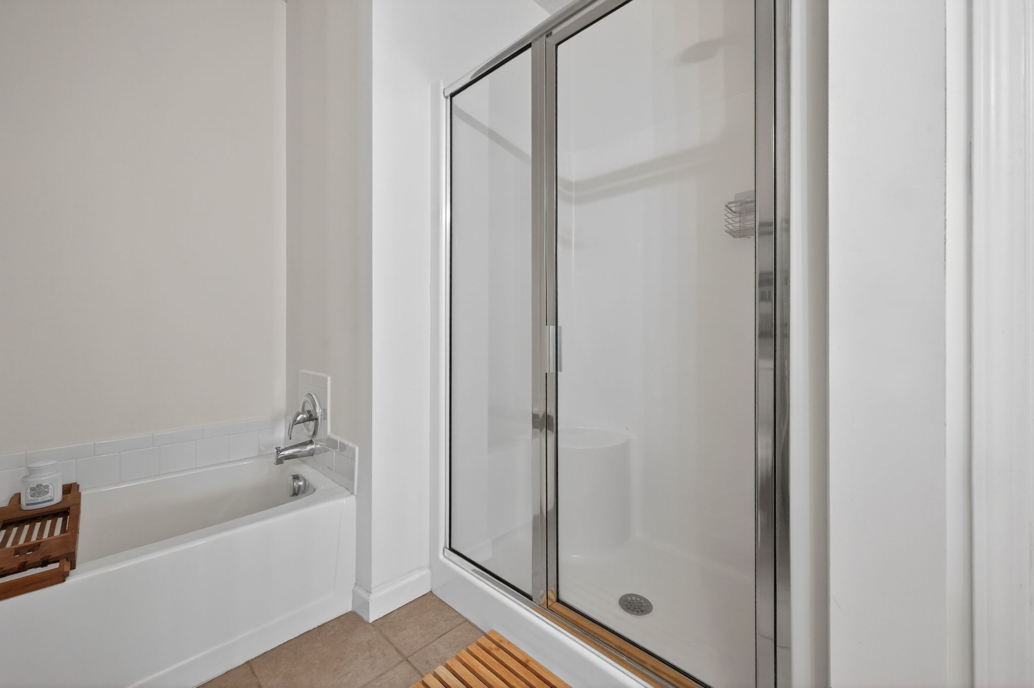 Huntscroft Lane Raleigh, NC 27617 - Photo 38 of 49 a bathroom with a bathtub and a shower