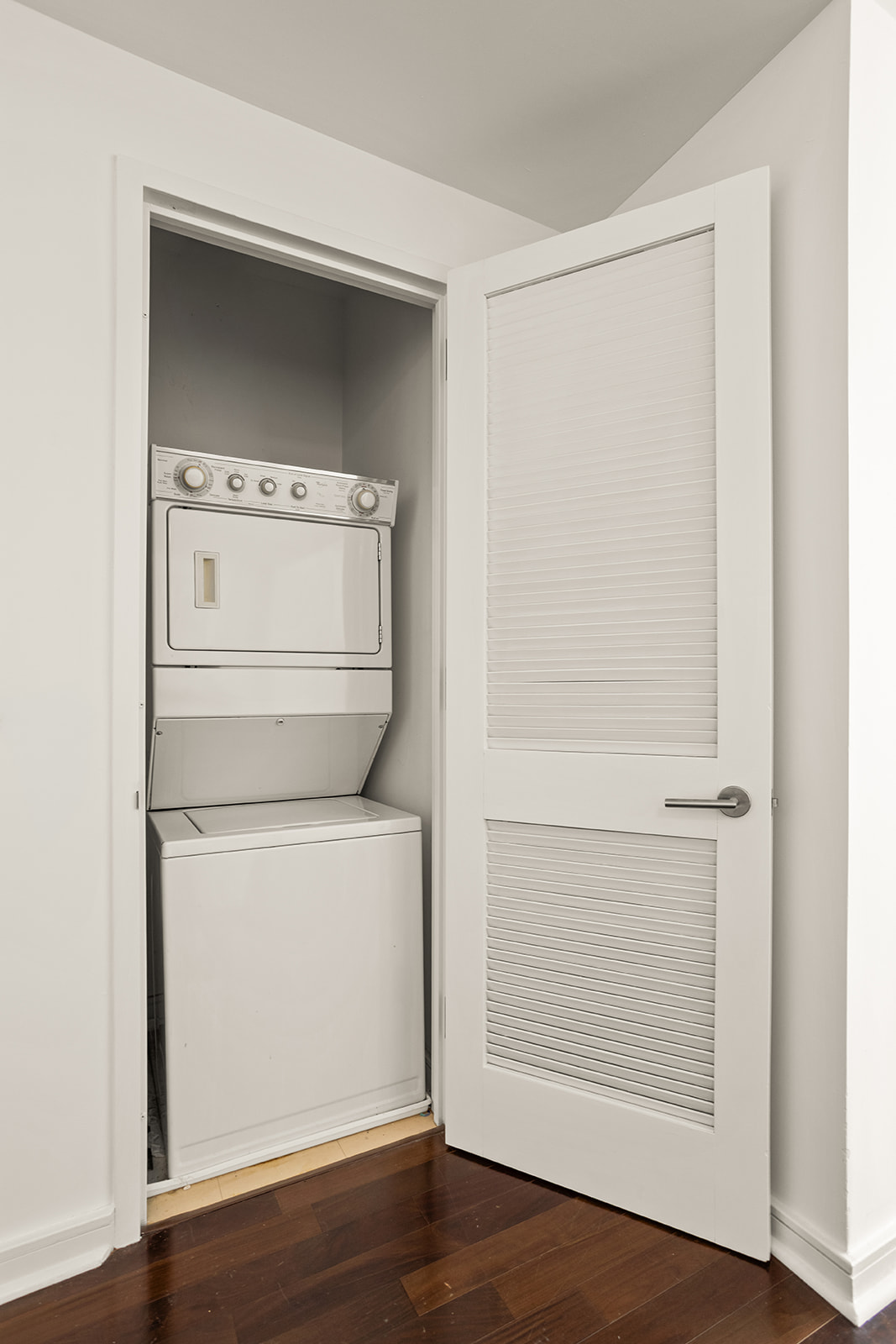 130 West 19th Street, Unit 7C Manhattan, NY 10011 - Photo 10 of 13 a utility room with dryer and washer