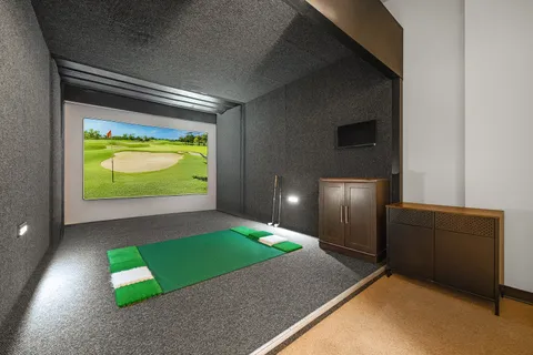 a view of room with windows book shelves