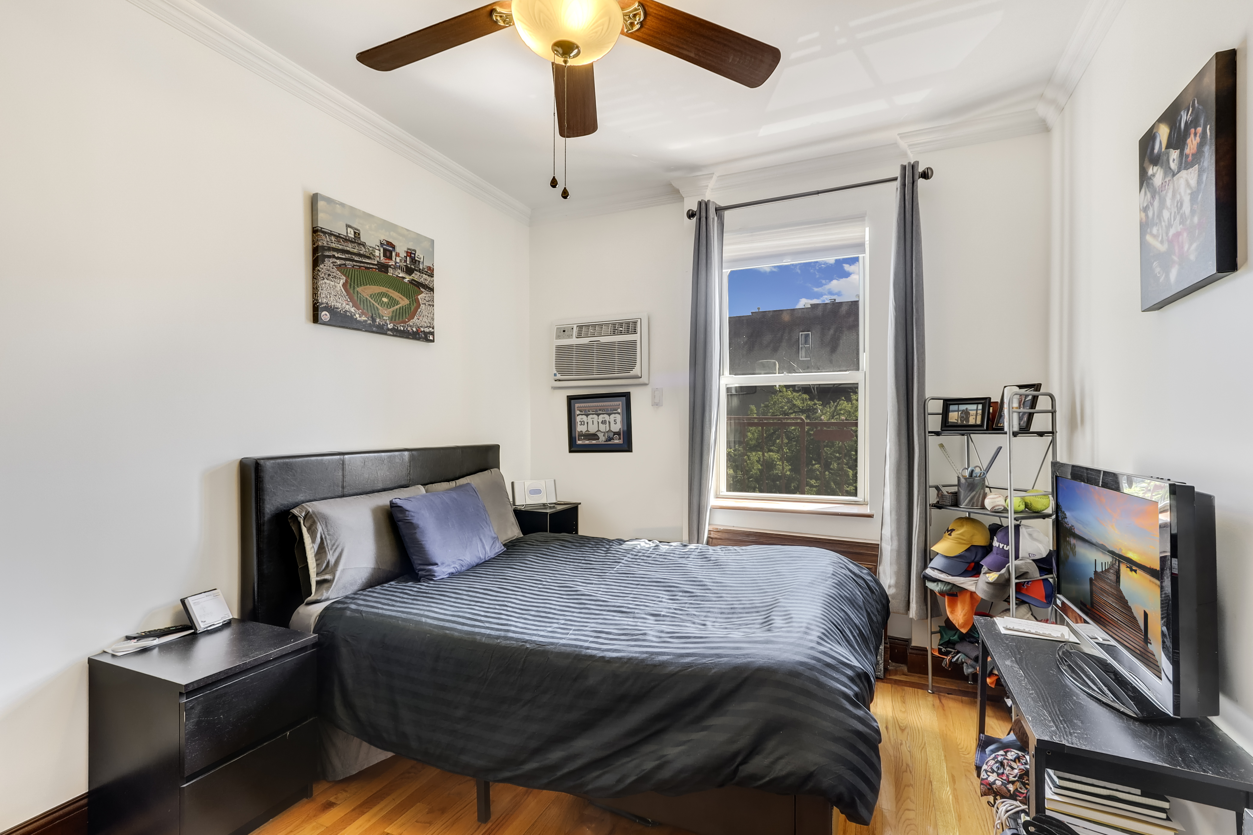 223 Smith Street, Unit 3F Brooklyn, NY 11201 - Photo 5 of 8 a bedroom with a bed and a window
