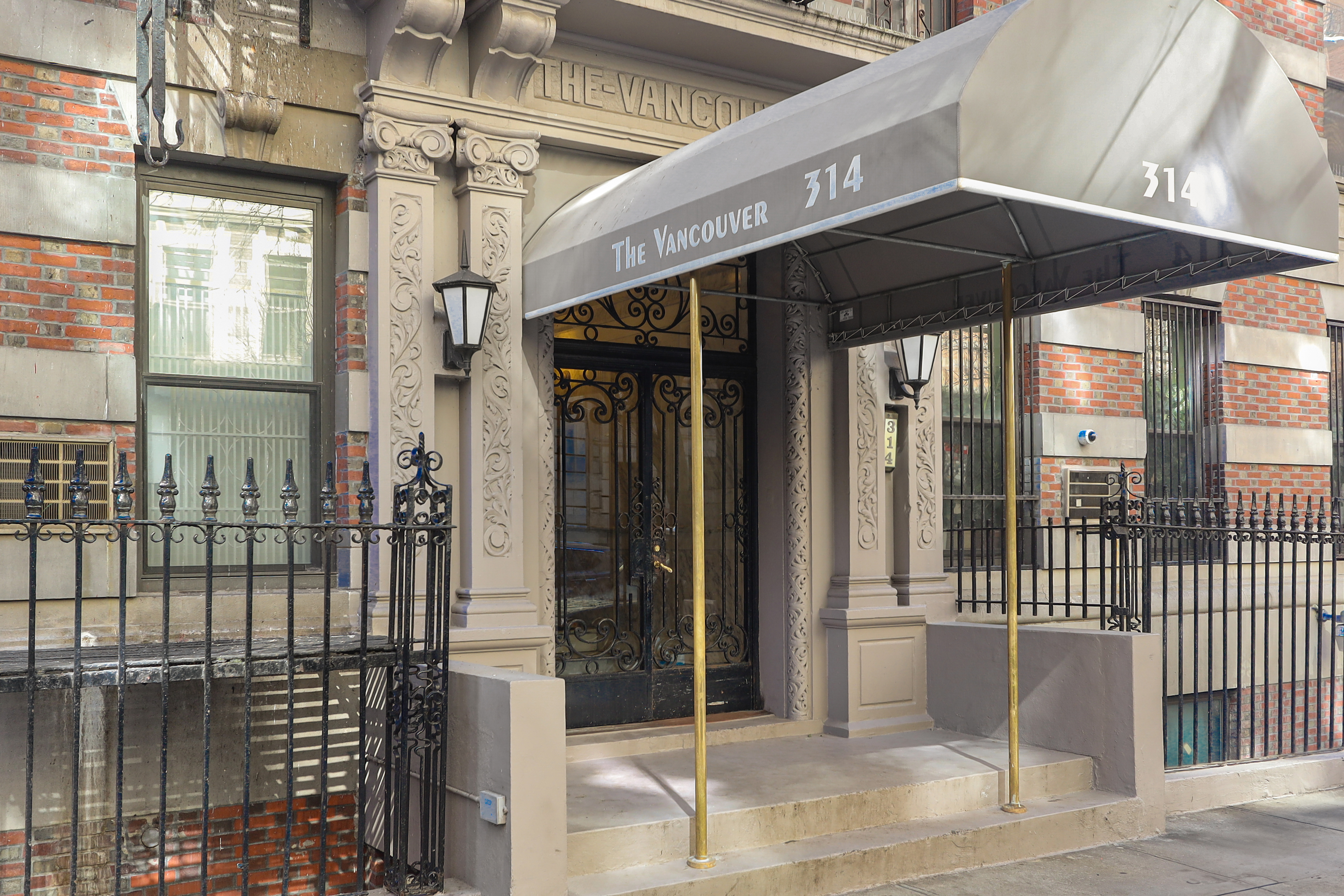 314 West 94th Street, Unit 5D Manhattan, NY 10025 - Photo 12 of 13 a front view of a building with glass door