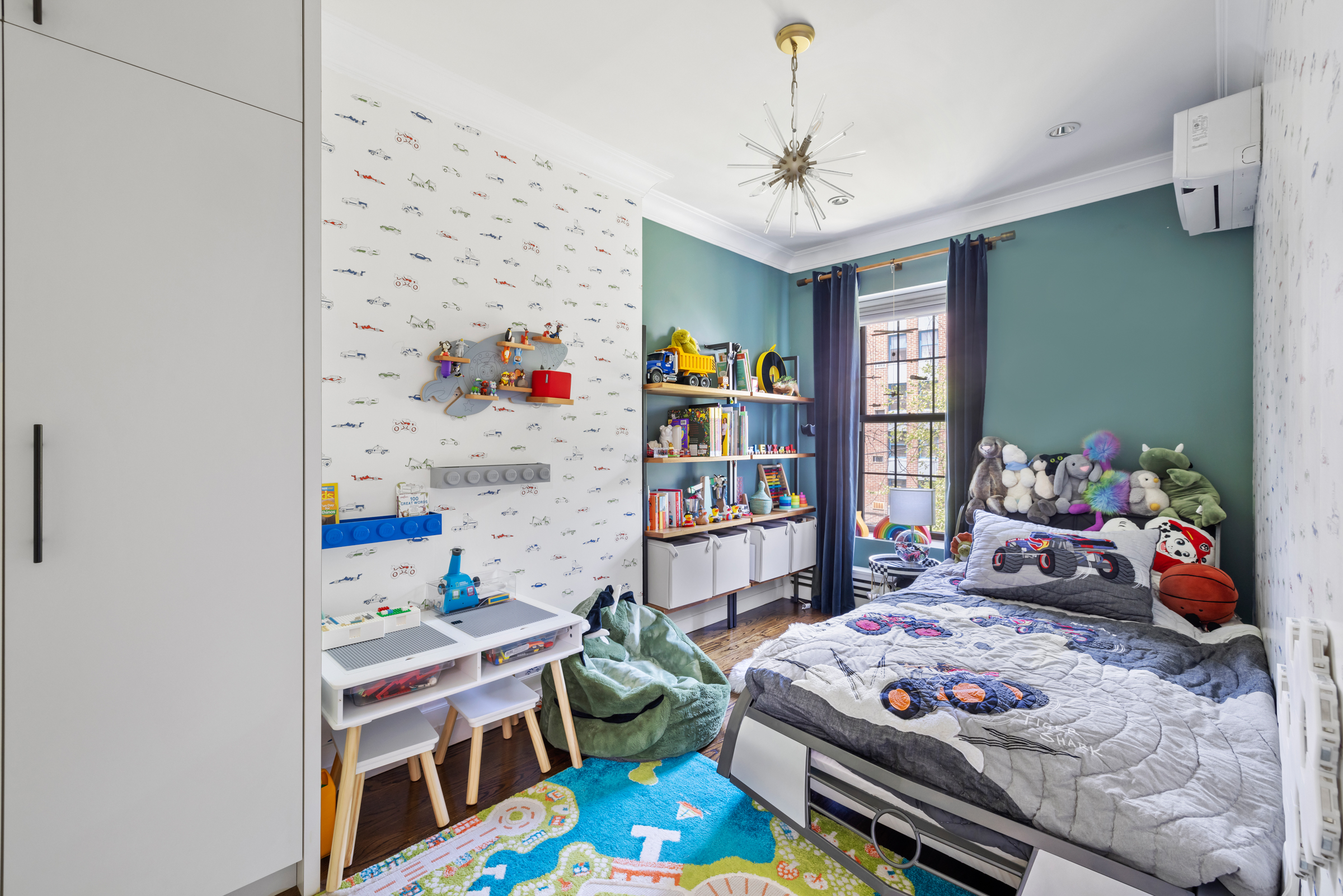 439 A Monroe Street Brooklyn, NY 11221 - Photo 15 of 29 a bedroom with furniture and a book shelf