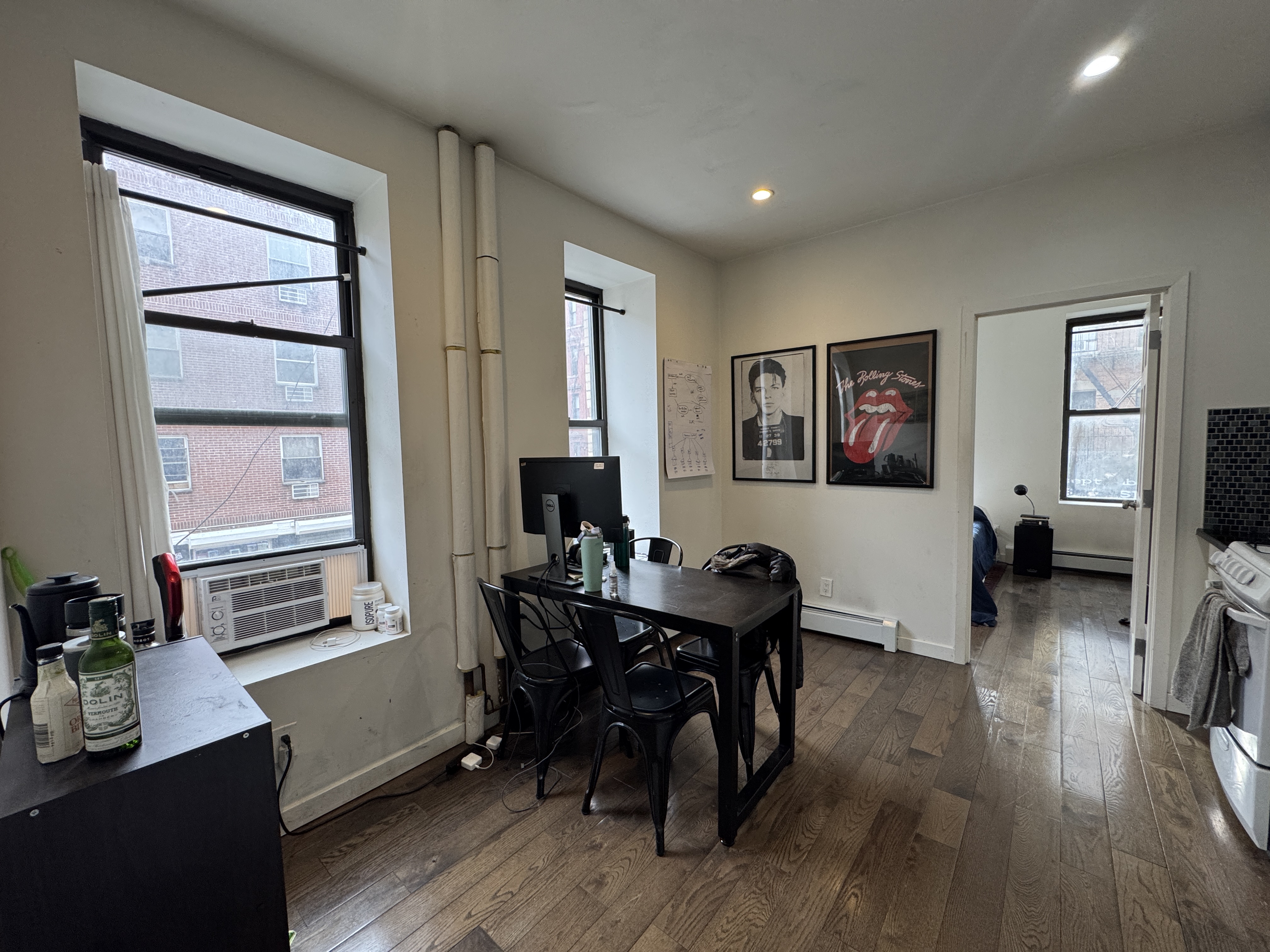 108 Stanton Street, Unit 1A Manhattan, NY 10002 - Photo 7 of 11 a view of a workspace with furniture and a window
