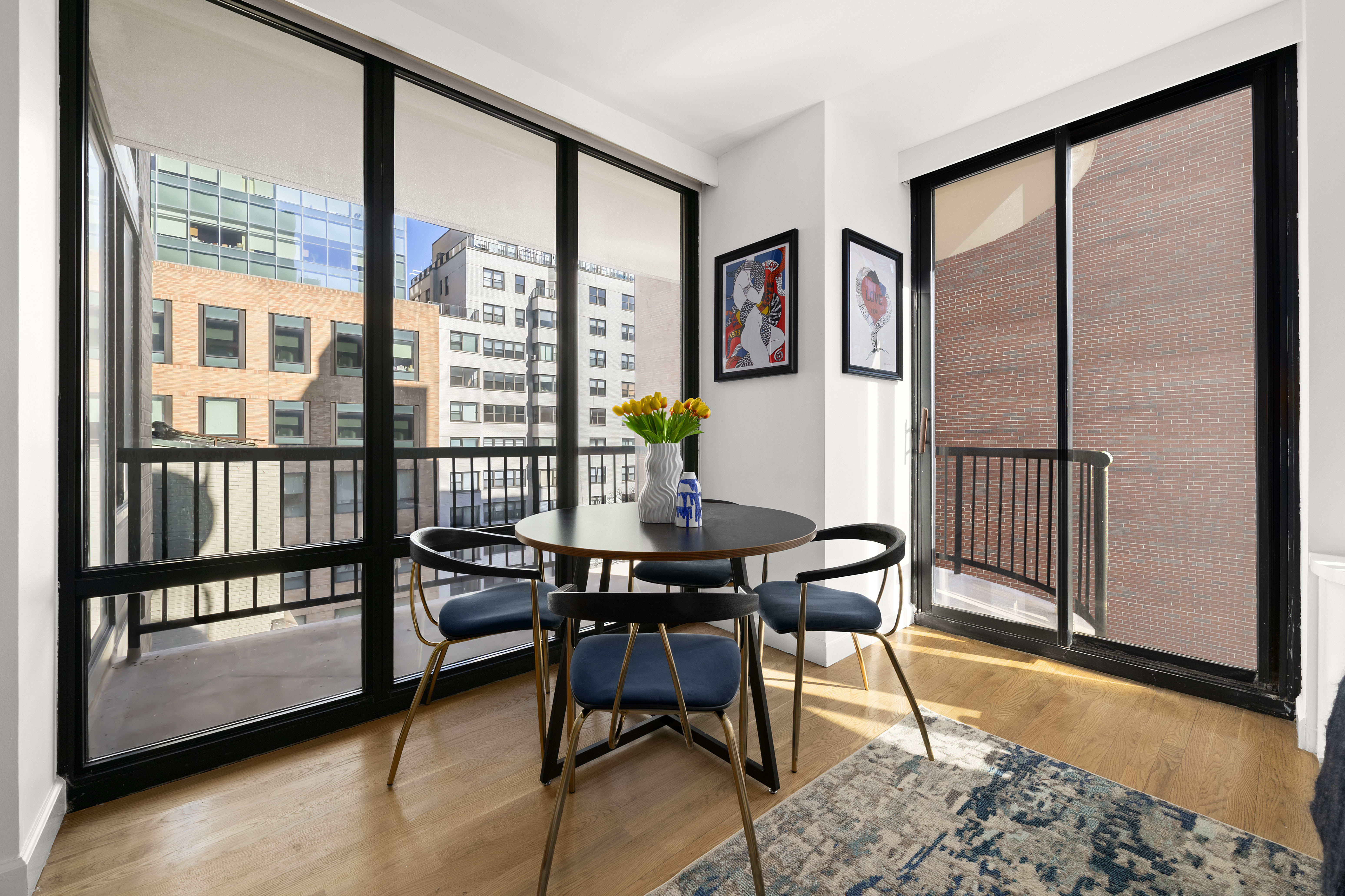 304 East 65th Street, Unit 6D Manhattan, NY 10065 - Photo 3 of 15 a workspace with furniture and a window