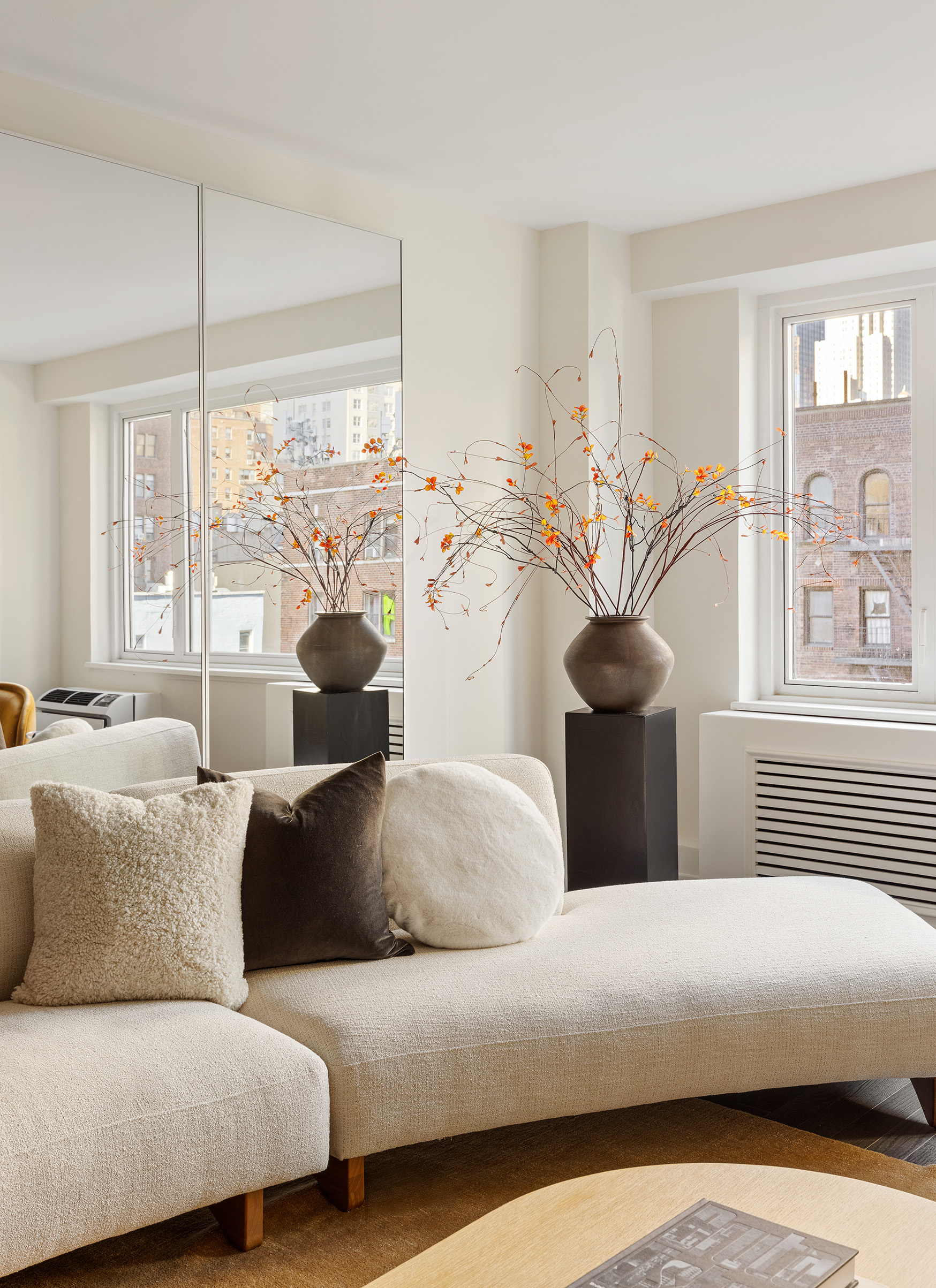 411 East 53rd Street, Unit 6L Manhattan, NY 10022 - Photo 2 of 12 a living room with furniture and a large window