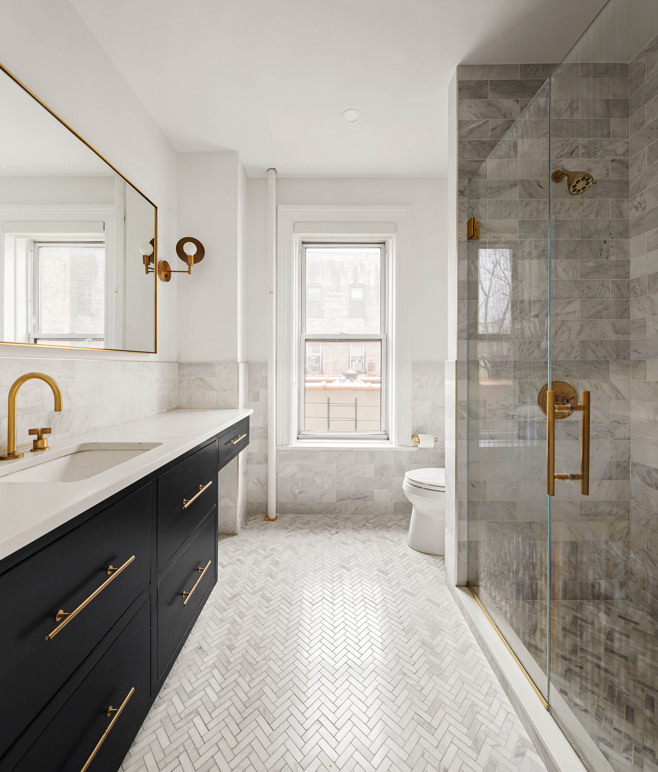 541 8th Street, Unit 3R Brooklyn, NY 11215 - Photo 6 of 9 a spacious bathroom with a granite countertop sink a toilet a mirror and shower