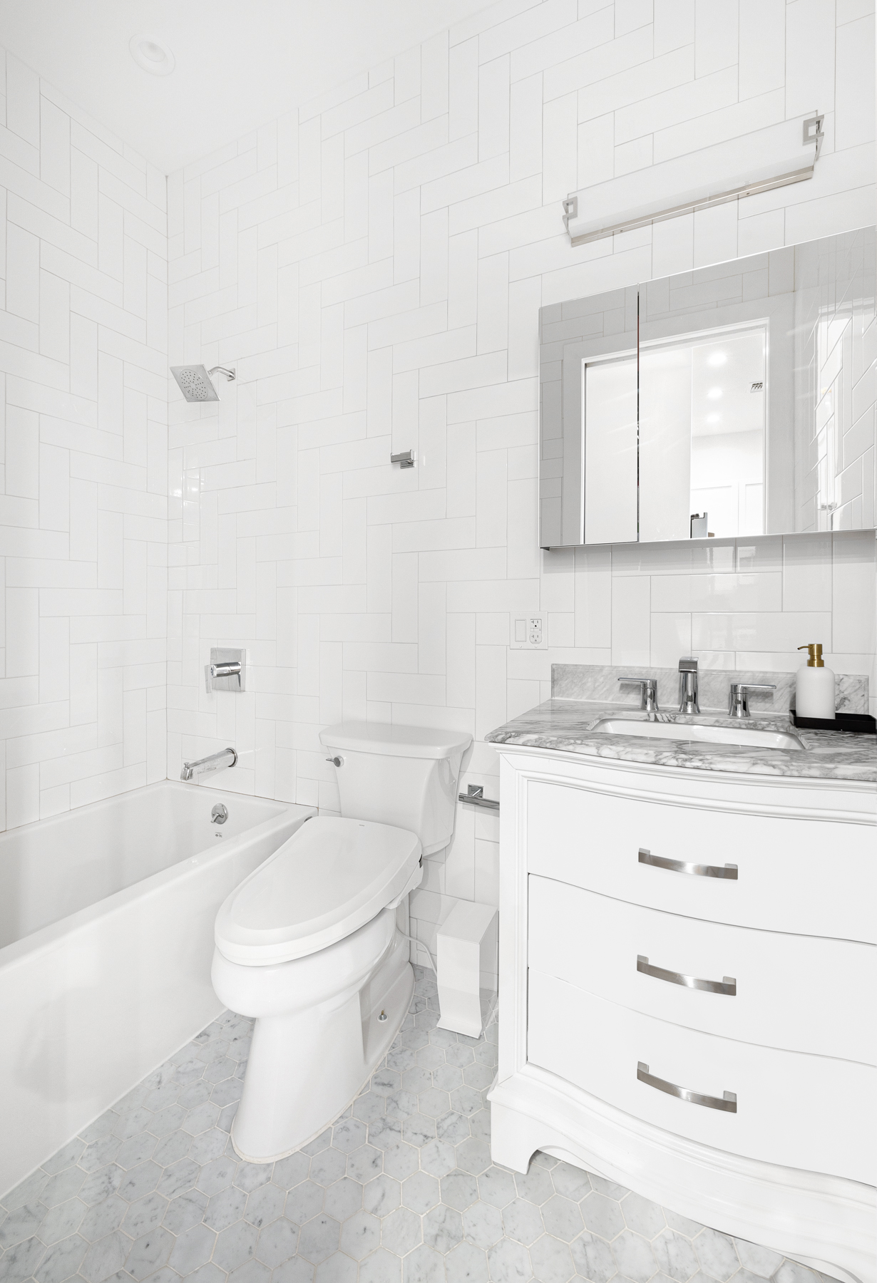 110 Summit Street, Unit 2 Brooklyn, NY 11231 - Photo 10 of 13 a bathroom with a granite countertop toilet sink and mirror