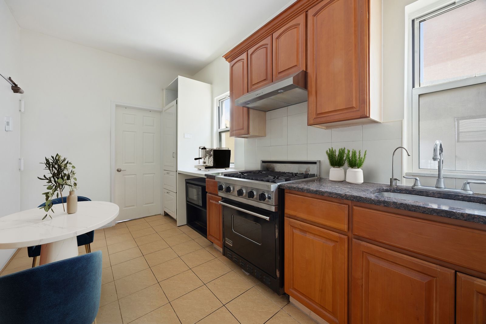 25 Bogart Street, Unit 3S Brooklyn, NY 11206 - Photo 2 of 7 a kitchen with stainless steel appliances granite countertop a sink stove and cabinets