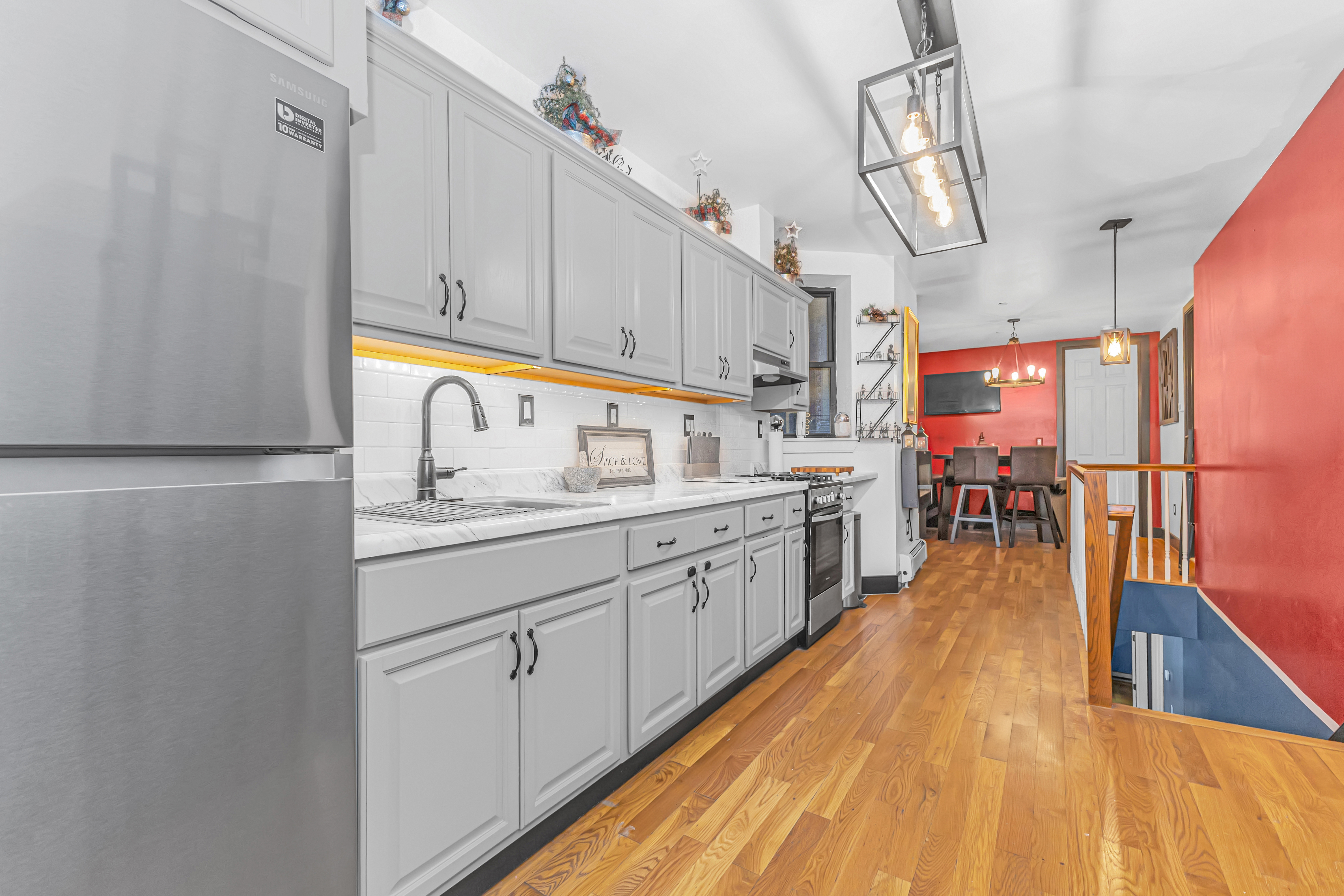 786 Madison Street, Unit 3B Brooklyn, NY 11221 - Photo 6 of 11 a kitchen with cabinets a sink and appliances
