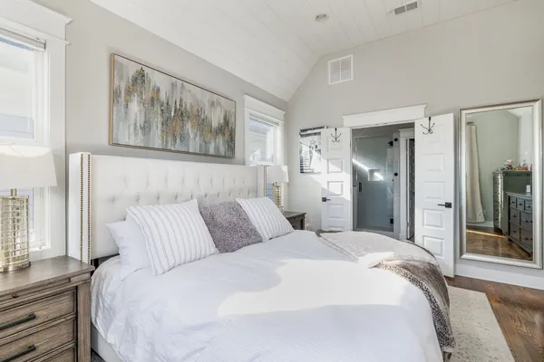 a bathroom with a shower sink vanity and mirror