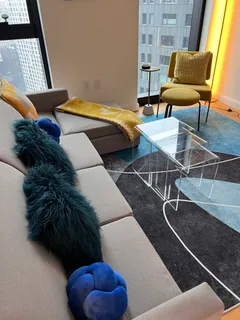 a living room with a couch and a chair