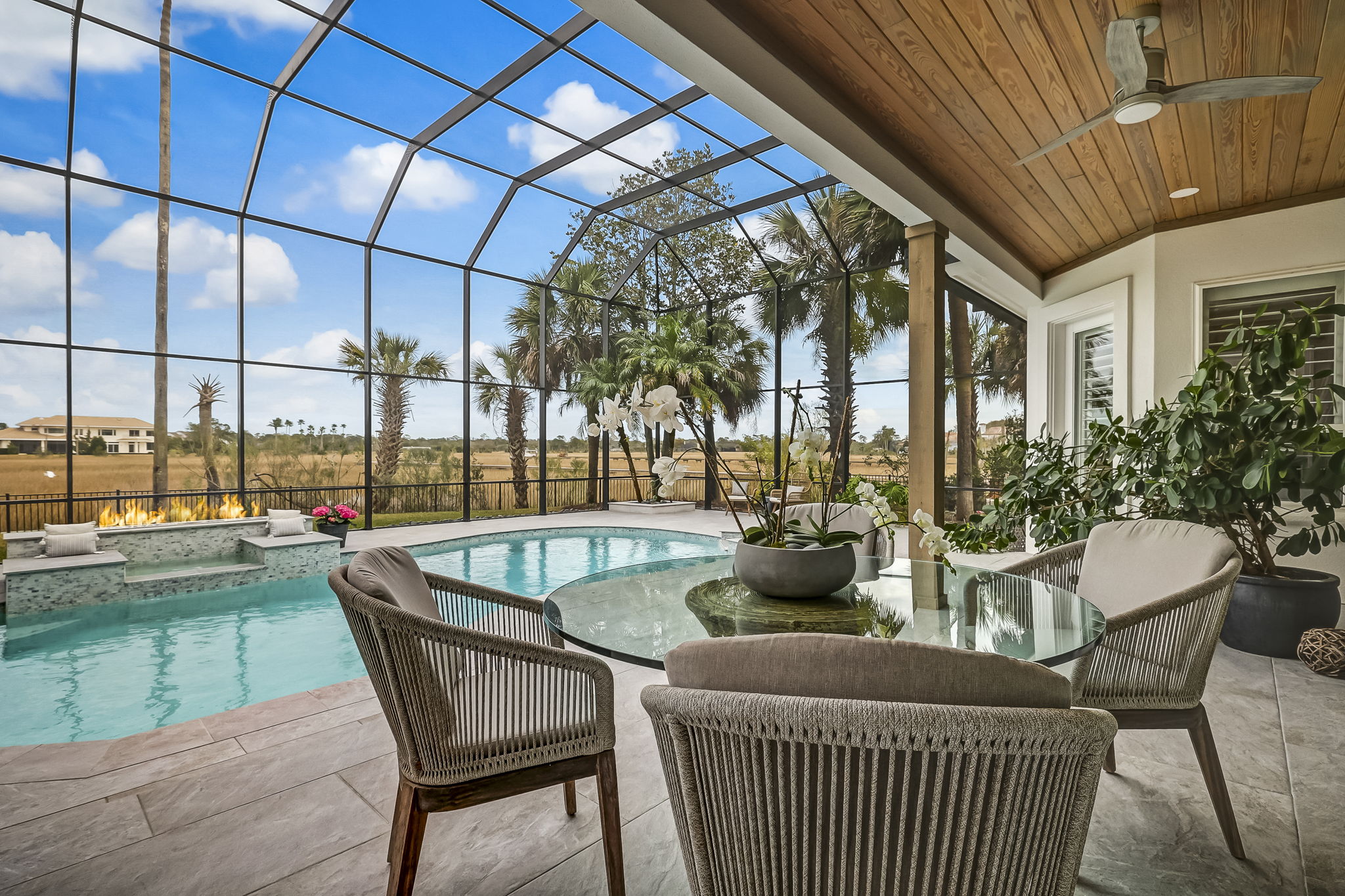 24624 Harbour View Drive Ponte Vedra Beach, FL 32082 - Photo 109 of 186 a view of a patio with a dining table and chairs with wooden floor