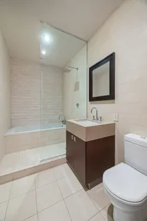 a bathroom with a toilet sink and bathtub