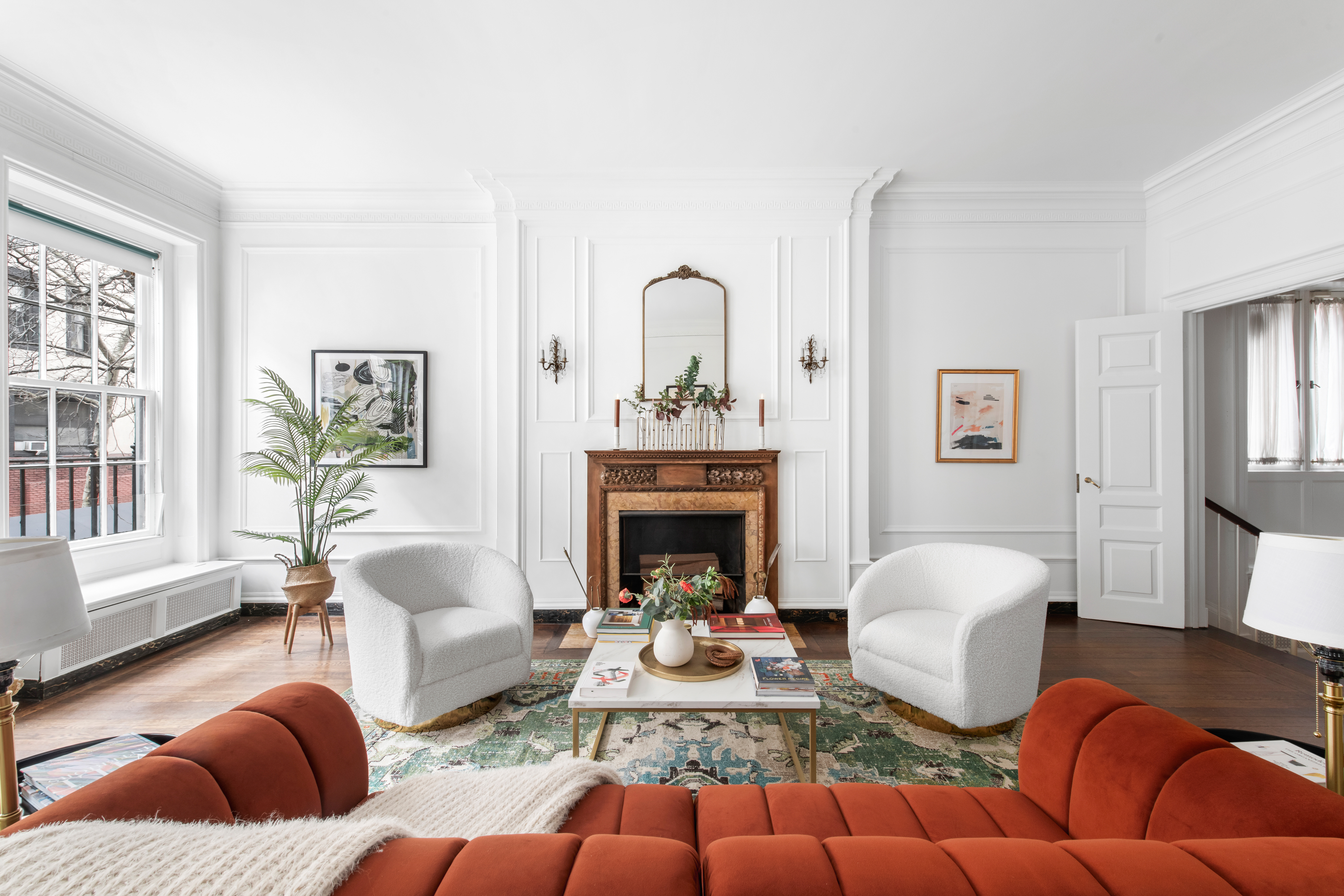 155 East 70th Street Manhattan, NY 10021 - Photo 3 of 27 a living room with furniture fireplace and a window
