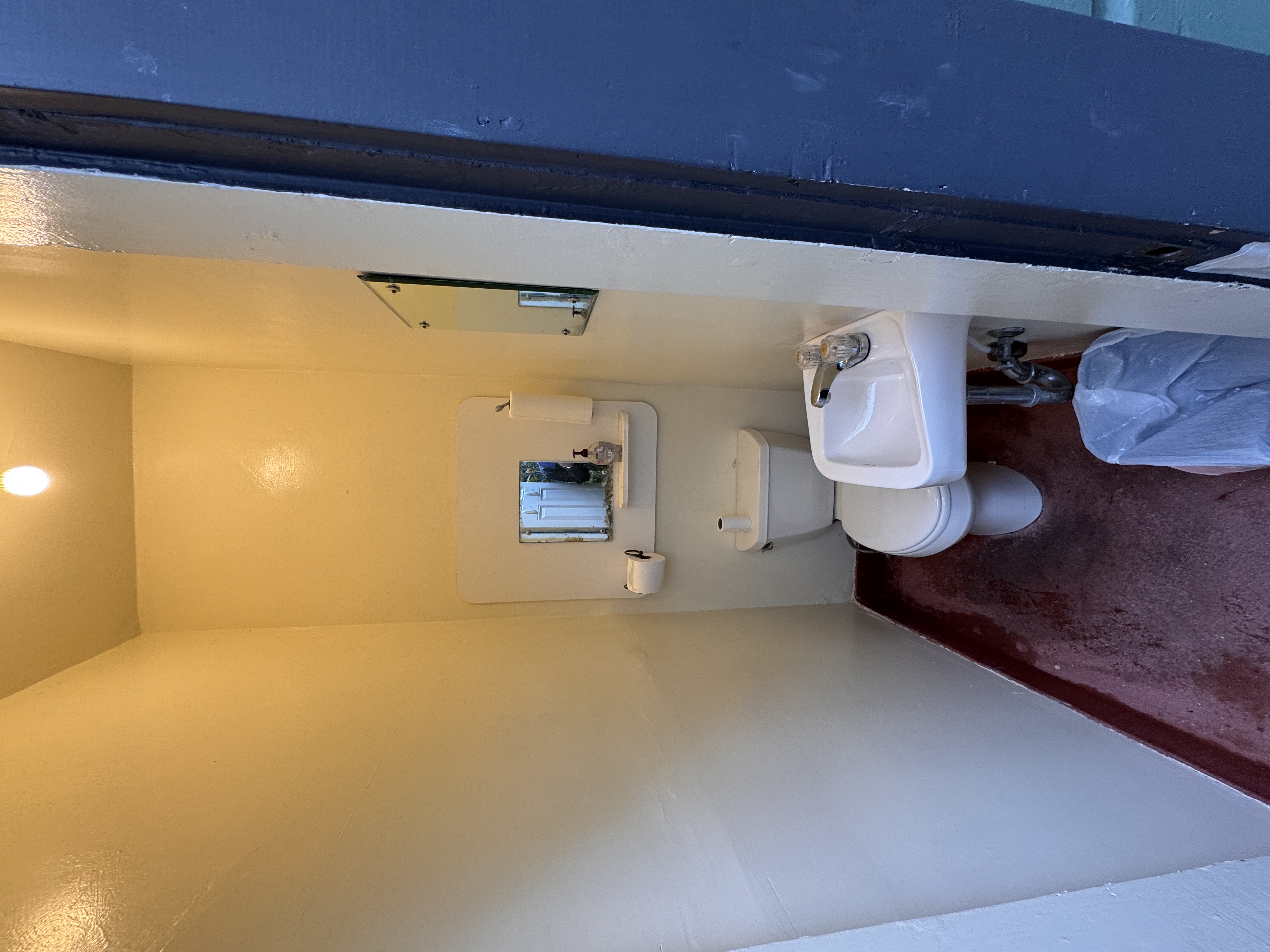 1454 Grant Avenue San Francisco, CA 94133 - Photo 22 of 34 a bathroom with a sink a toilet and a mirror