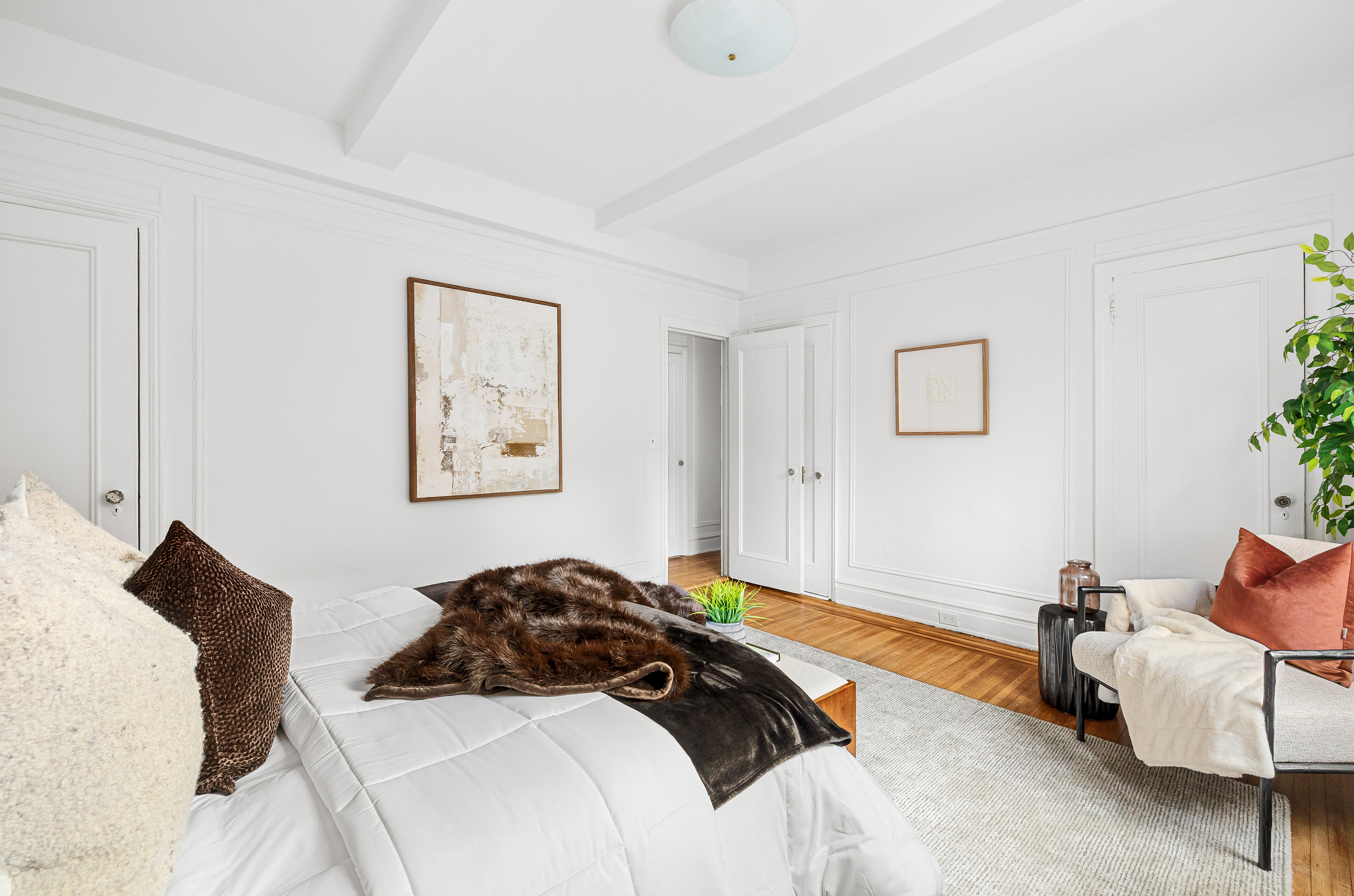 322 West 72nd Street, Unit 3D Manhattan, NY 10023 - Photo 5 of 19 a bedroom with a bed and wooden floor