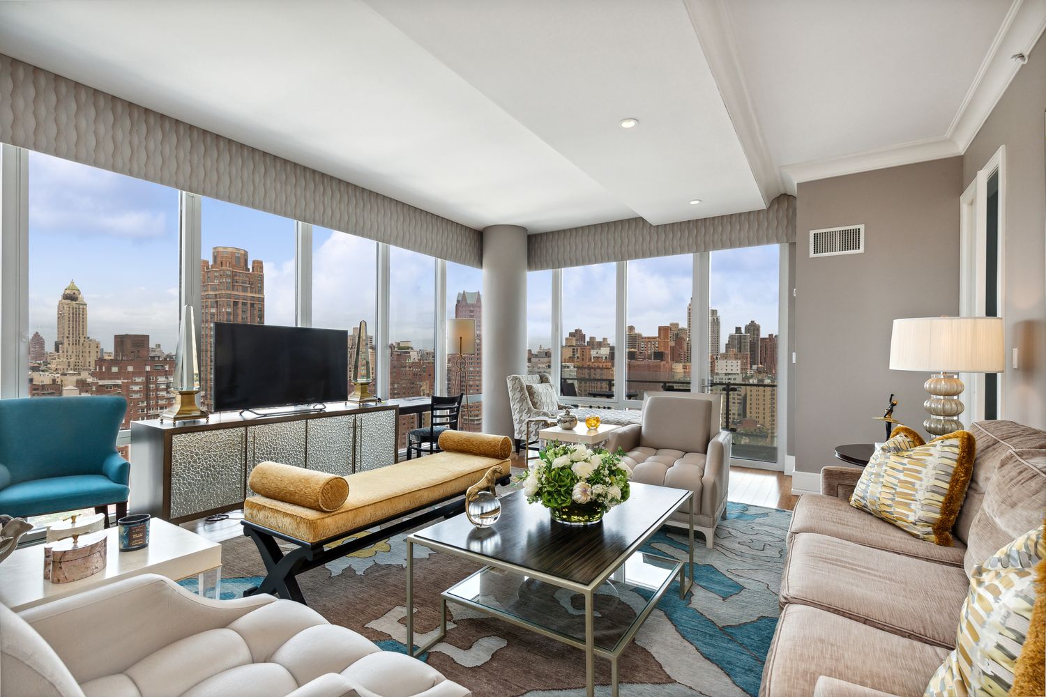 255 East 74th Street, Unit 20C Manhattan, NY 10021 - Photo 2 of 16 a living room with furniture and a flat screen tv