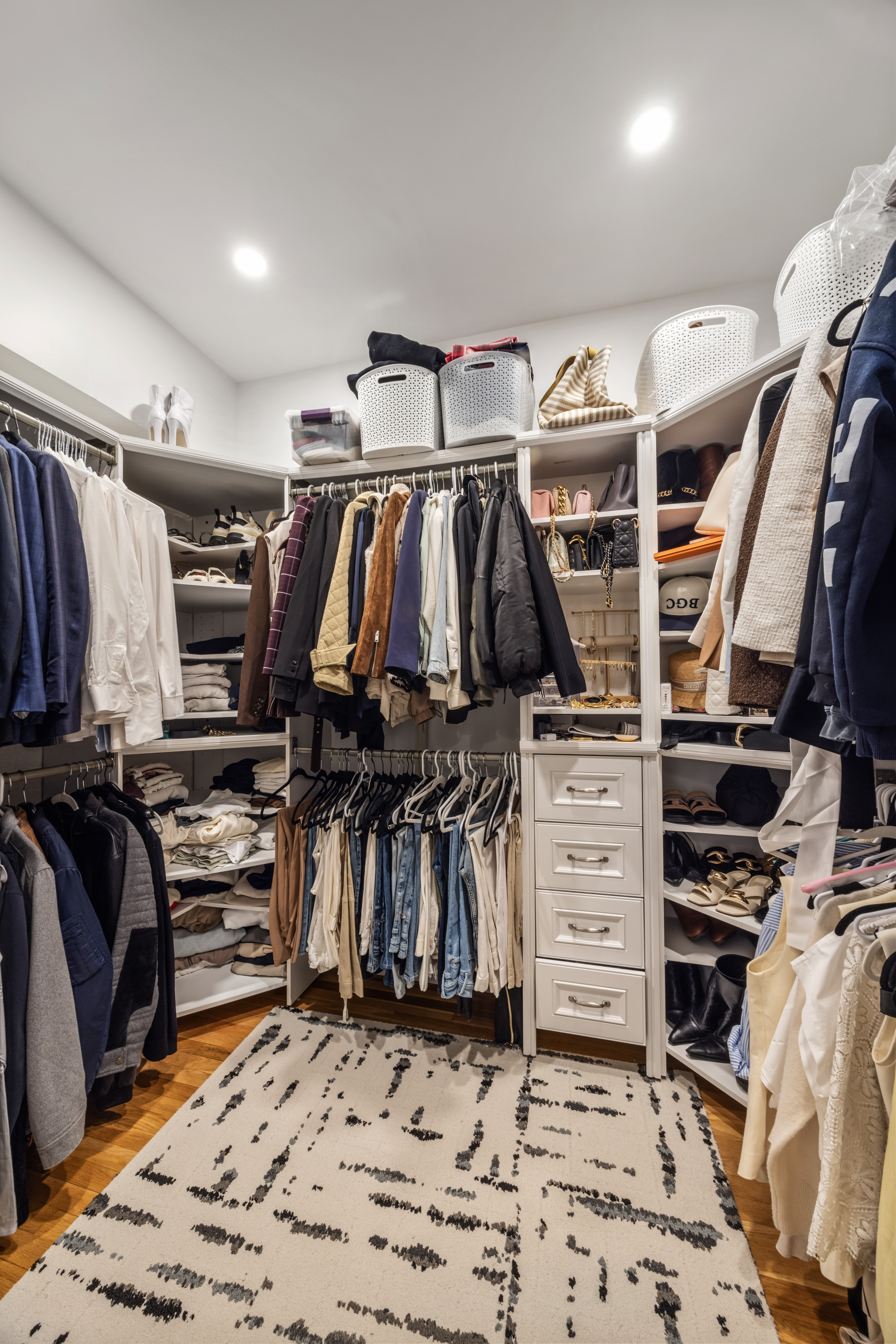 43 Murray Street, Unit Undisclosed Manhattan, NY 10007 - Photo 8 of 12 a view of walk in closet with clothes and shoes