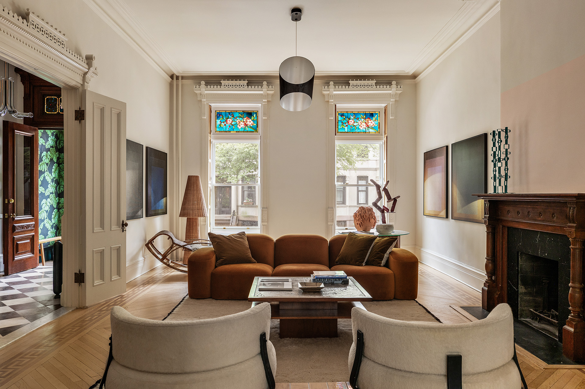 234 Clinton Street Brooklyn, NY 11201 - Photo 2 of 19 a living room with furniture a fireplace and a large window