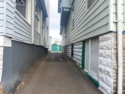 a view of a street with brick walls