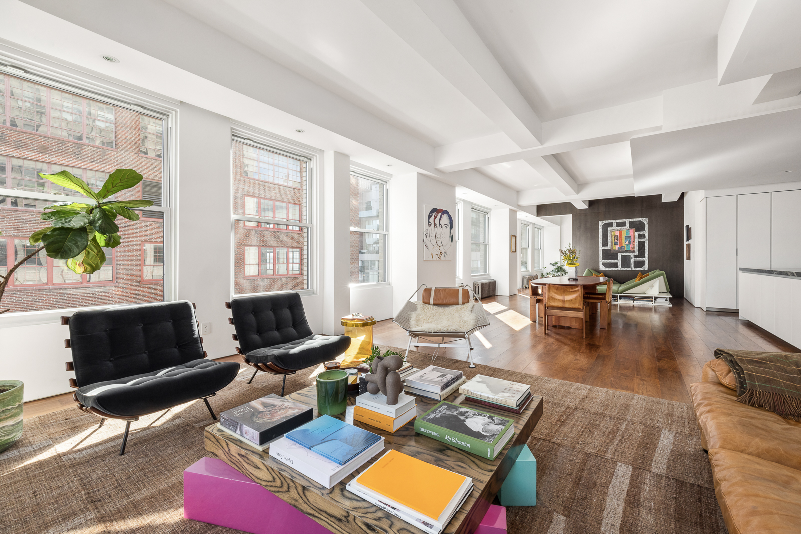 425 Park Avenue South, Unit 14CD Manhattan, NY 10016 - Photo 5 of 17 a living room with furniture and a floor to ceiling window