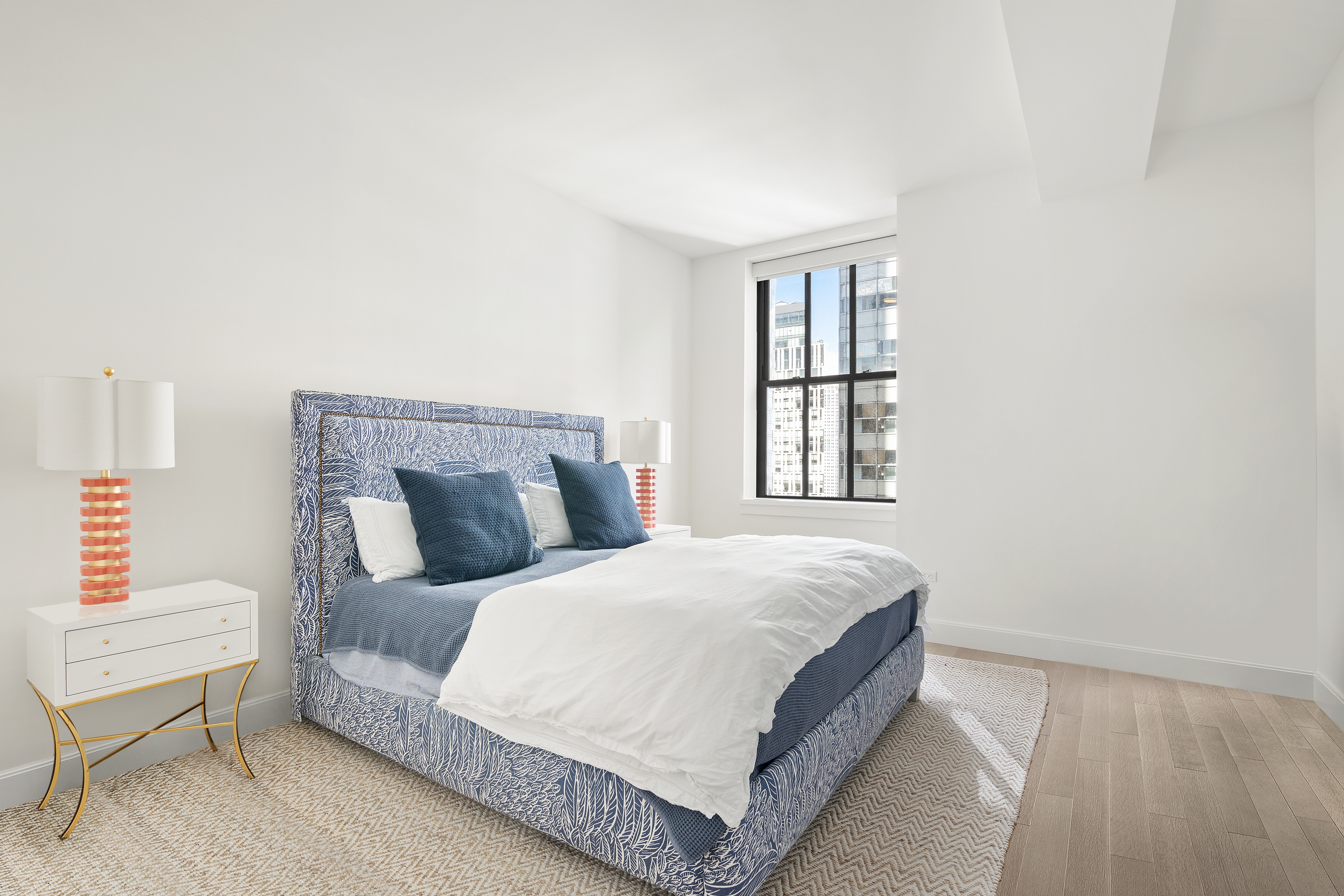 100 Barclay Street, Unit 16D Manhattan, NY 10007 - Photo 12 of 14 a bedroom with a bed and window