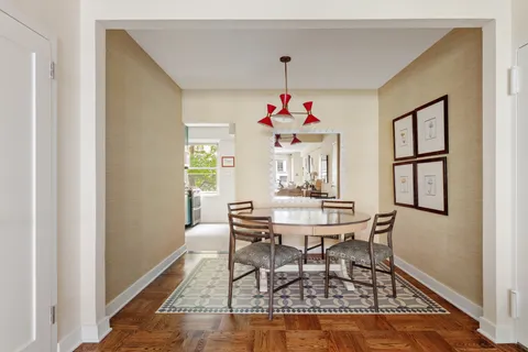 a view of a dining room with furniture and window