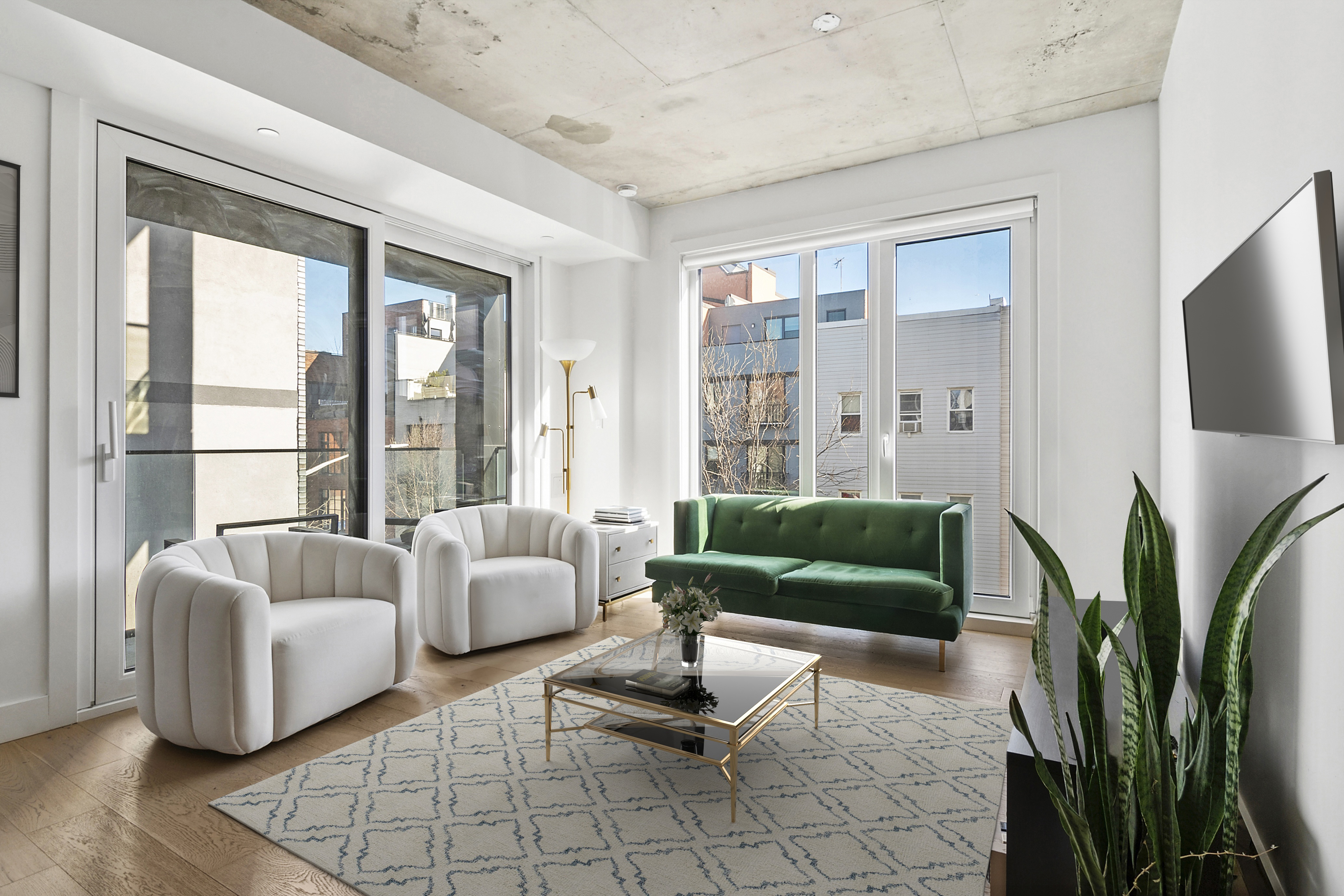 a living room with furniture and a flat screen tv