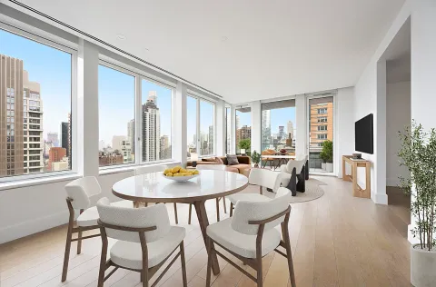 a dining room with furniture and window
