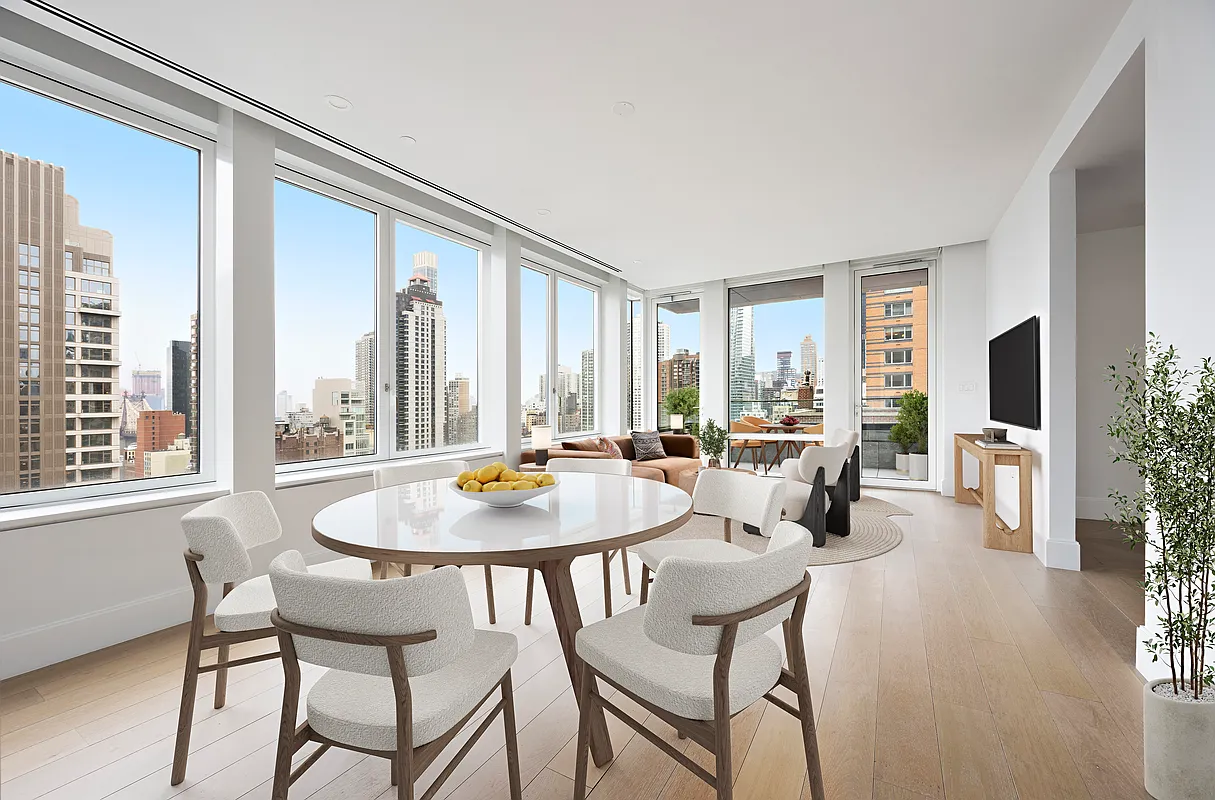 a dining room with furniture and window
