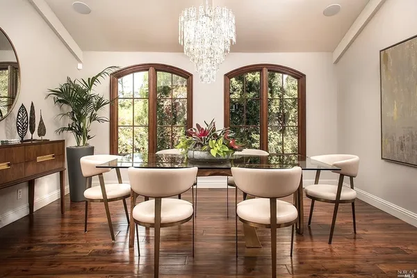 a view of a dining room with furniture window and wooden floor