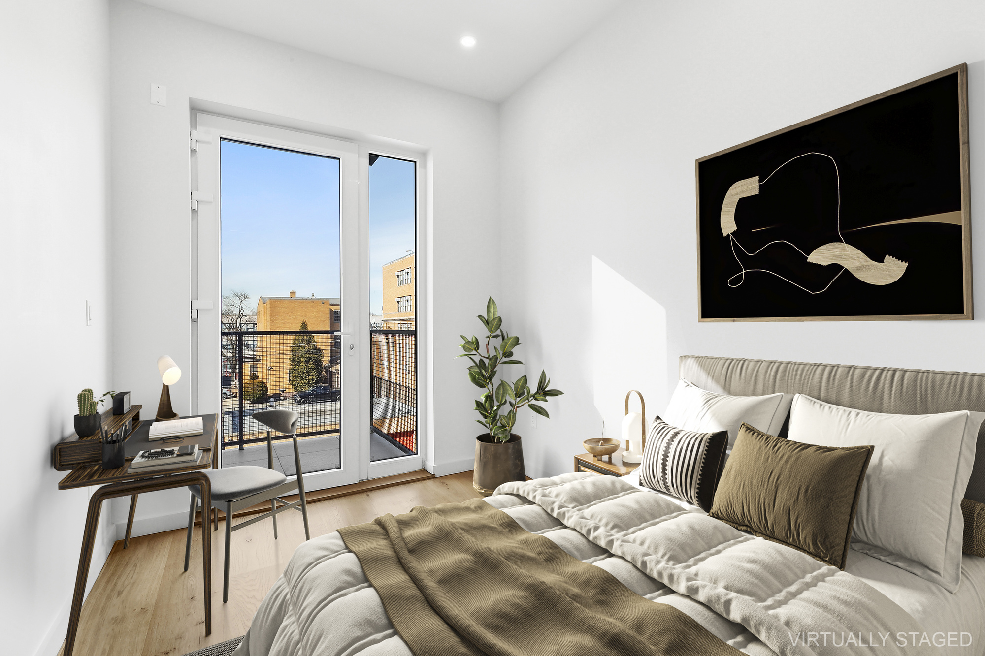 138 Schaefer Street, Unit 3A Brooklyn, NY 11207 - Photo 7 of 12 a bedroom with a bed and wooden floor