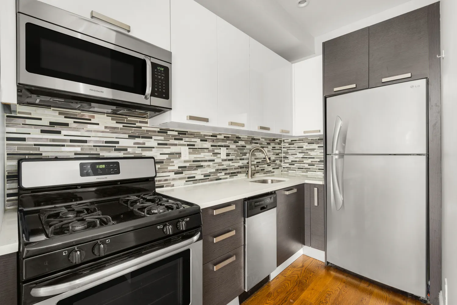 a kitchen with a stove and a microwave