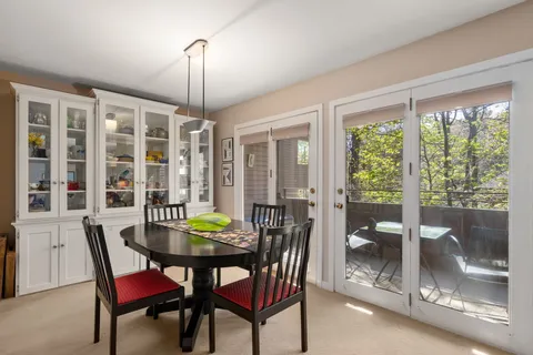 a view of a dining room with furniture window and outside view