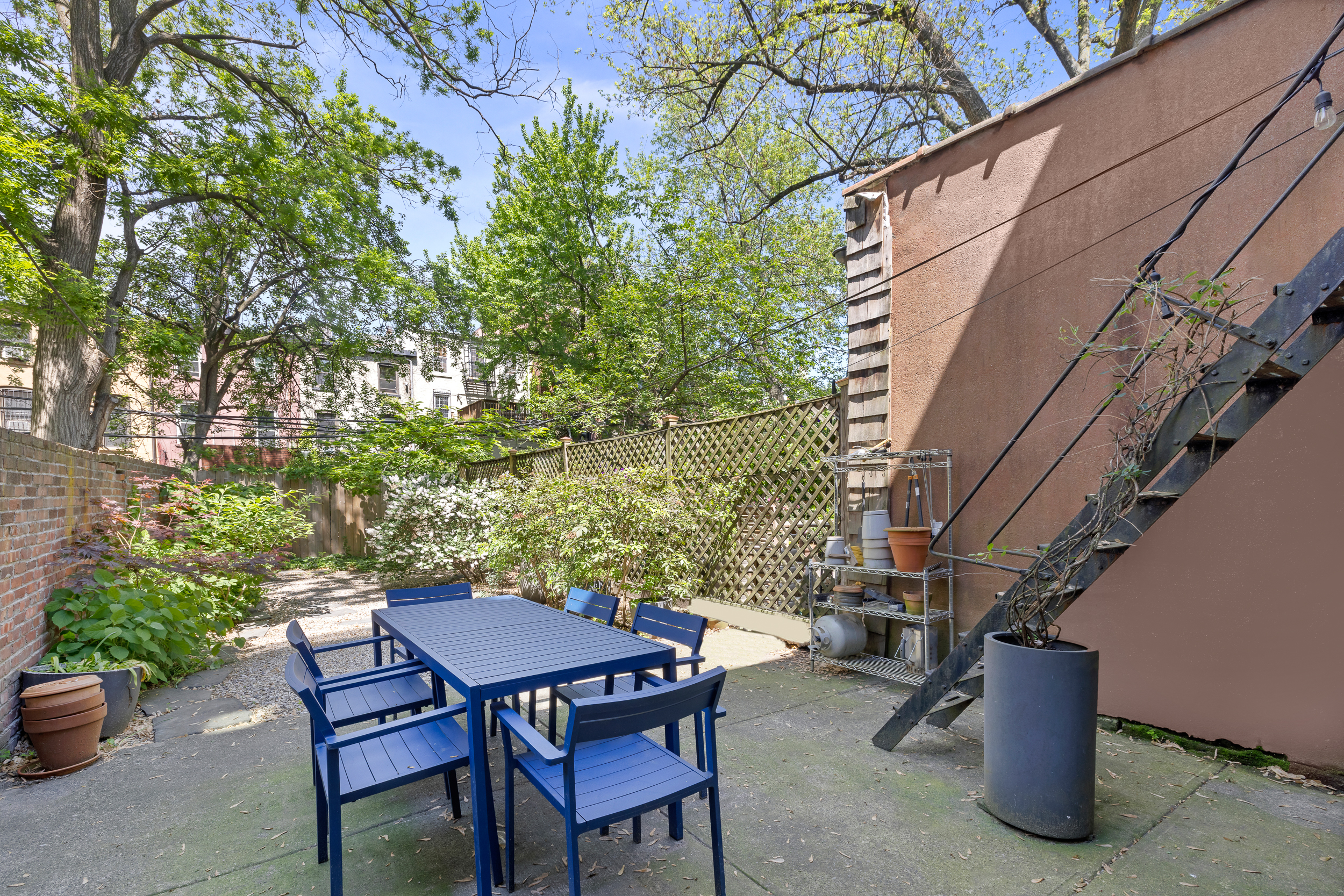 437 Warren Street Brooklyn, NY 11217 - Photo 13 of 17 a view of backyard with outdoor seating and plants