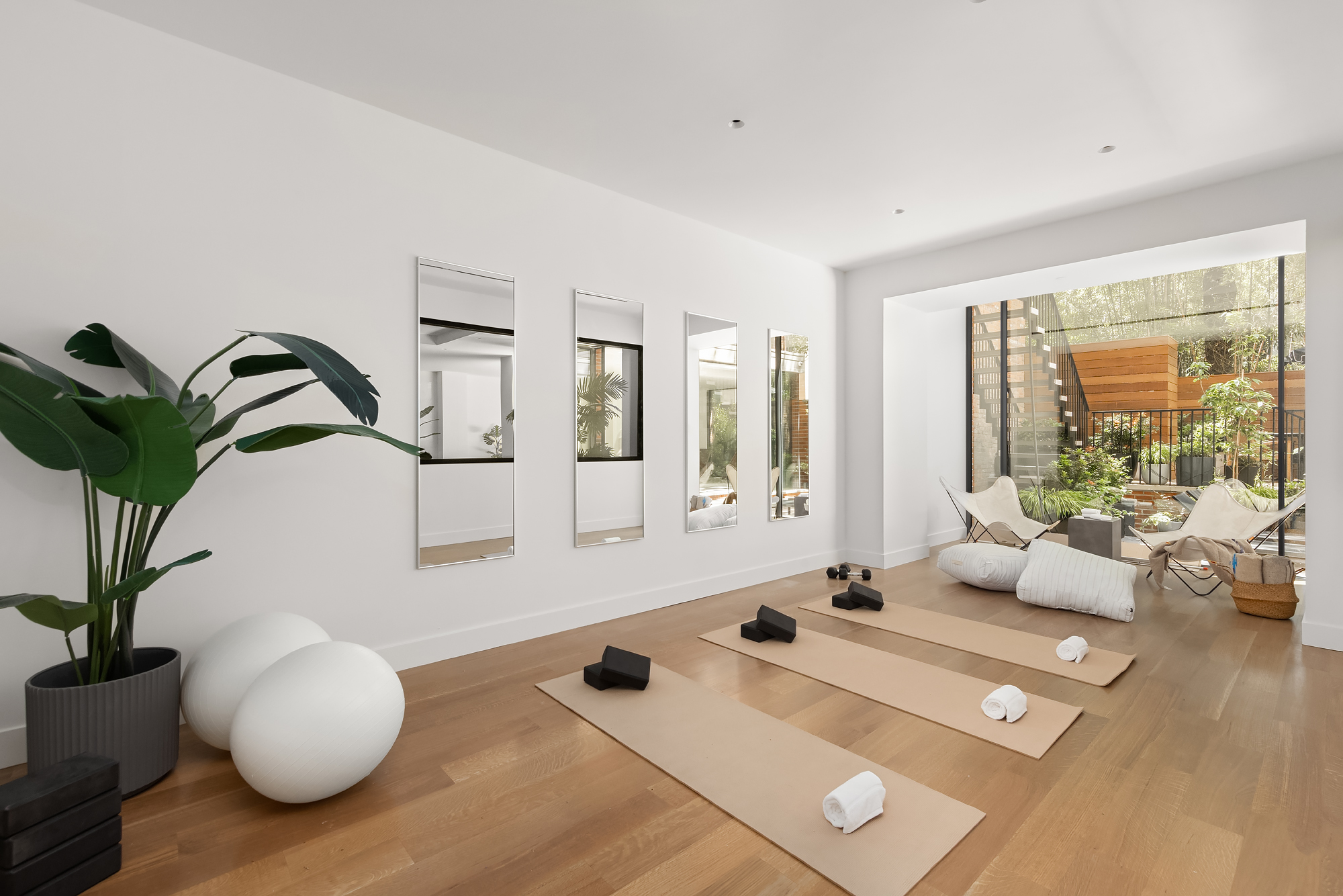 48-50 West 69th Street Manhattan, NY 10023 - Photo 27 of 33 a living room with furniture potted plant and a large window